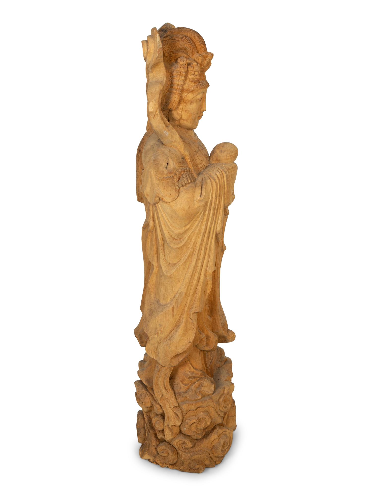 A Carved Wood Figure of Guanyin