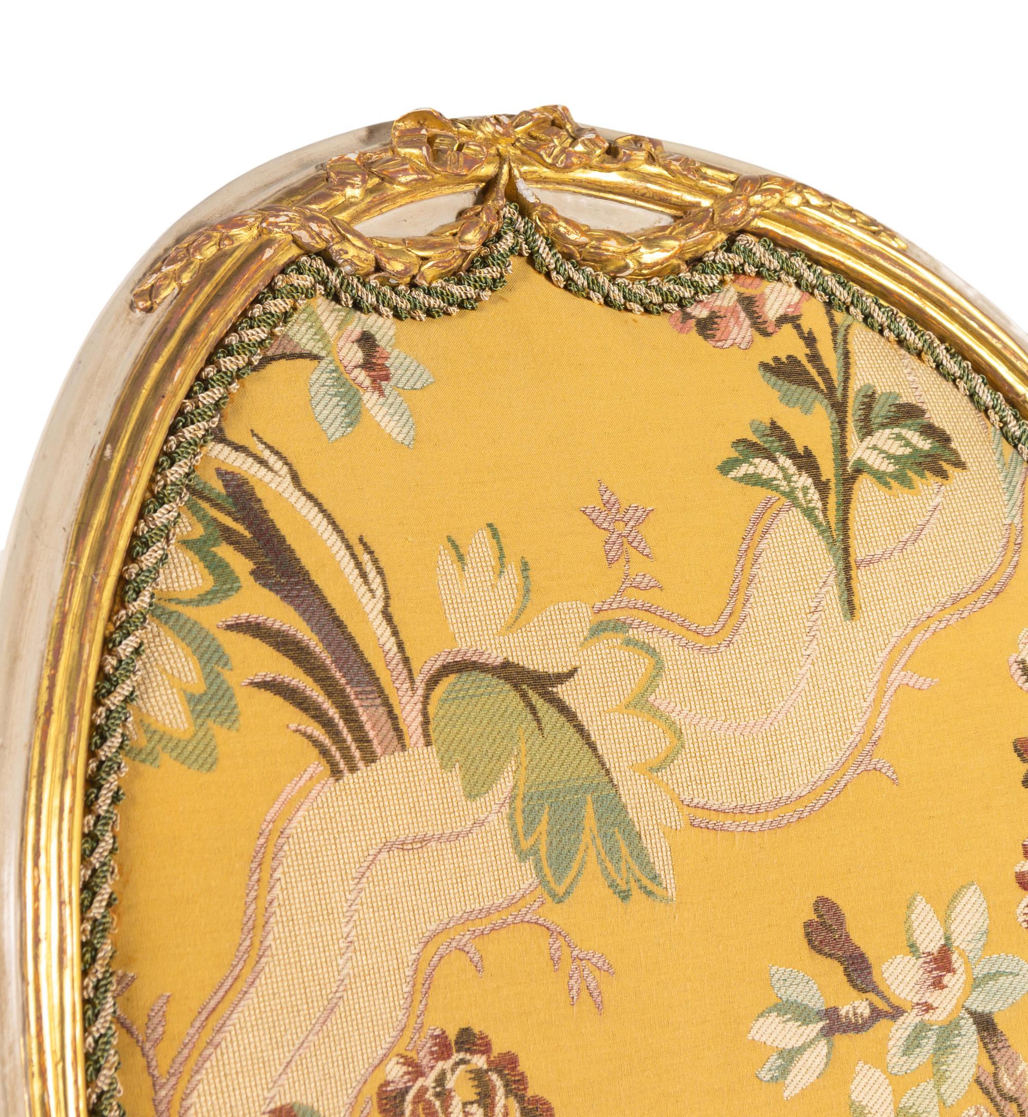 A George III White-Painted and Parcel-Gilt Open Armchair
