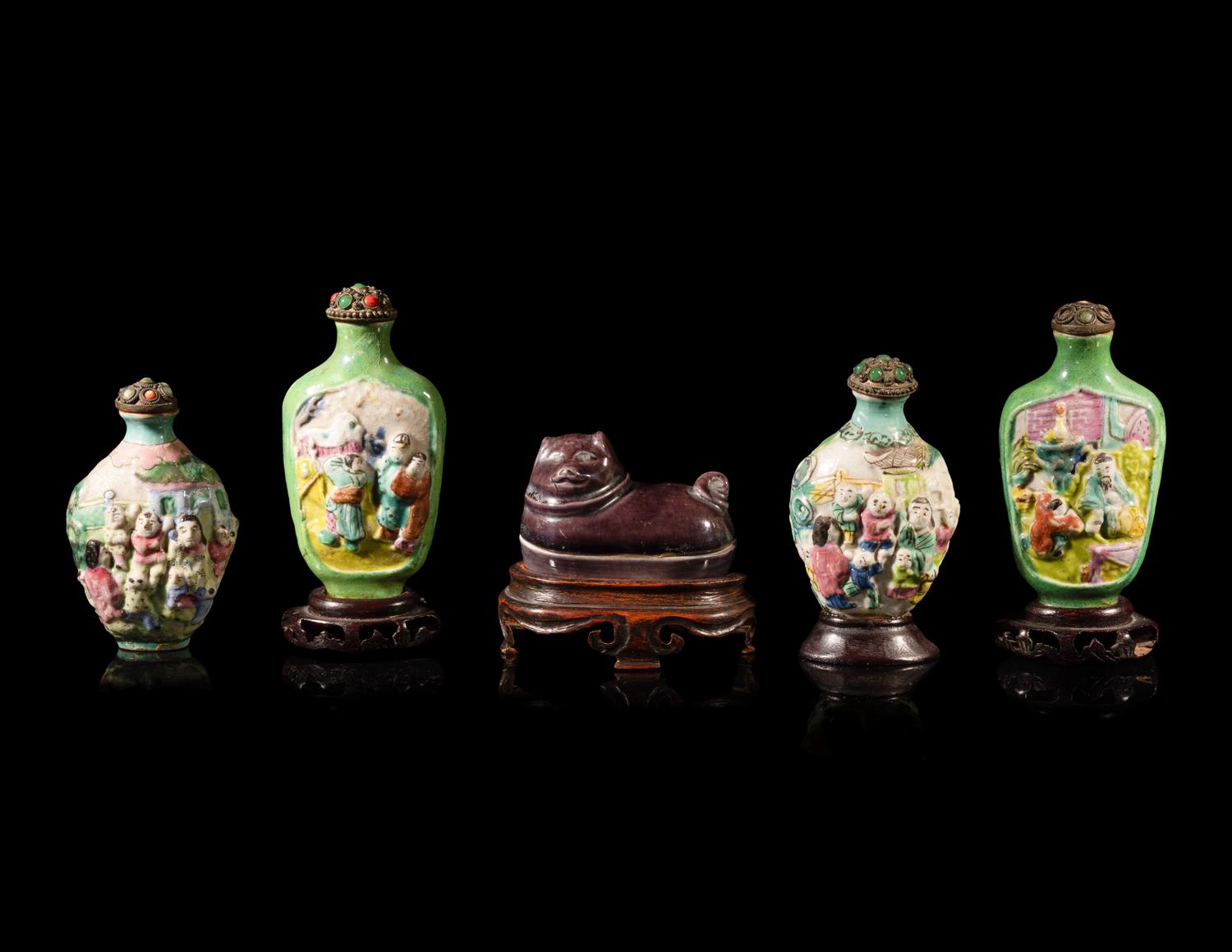 Four Chinese Famille Rose Porcelain Snuff Bottles and A Aubergine Glazed Porcelain Dog-Form Paper Weight
