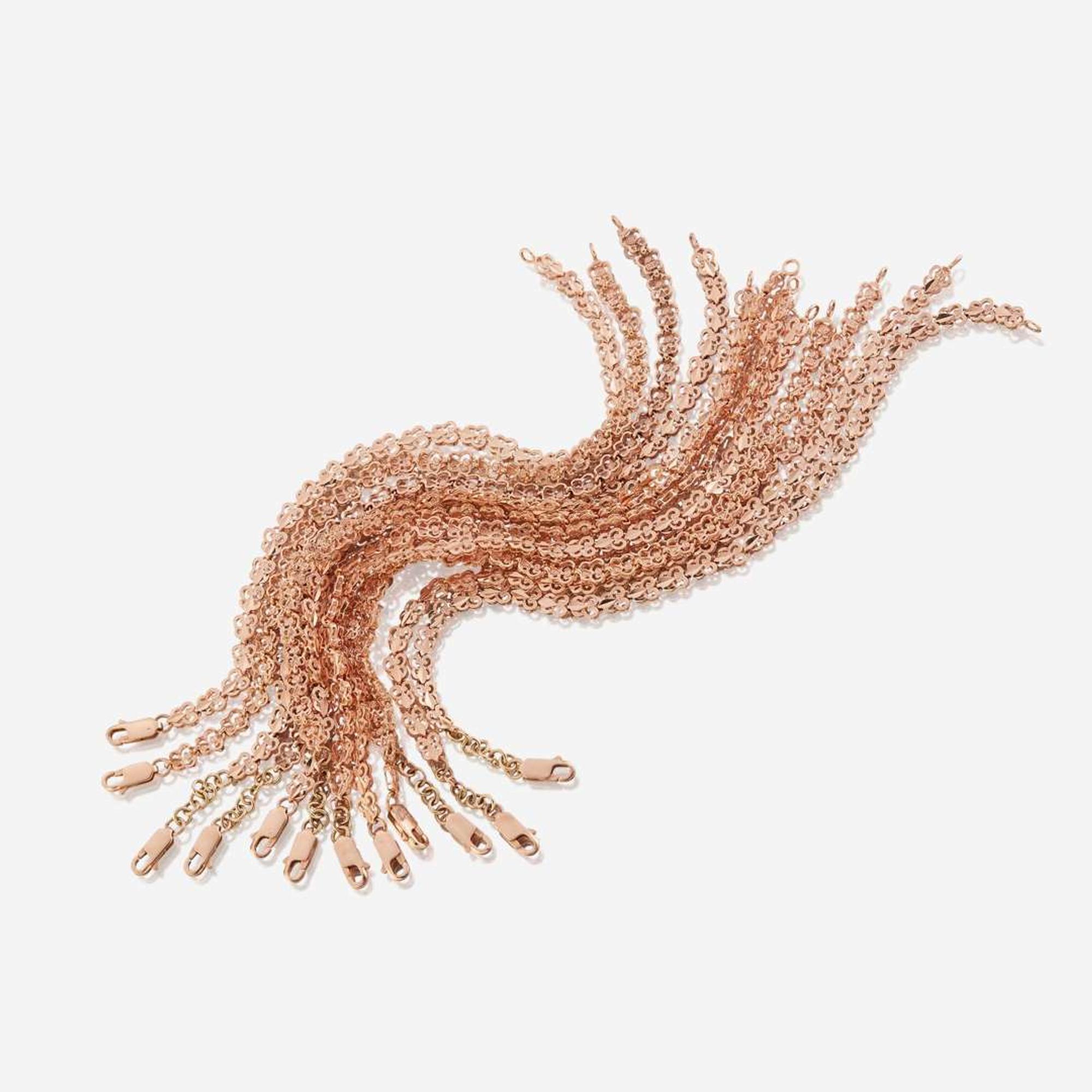 A collection of twelve fourteen karat rose gold bracelets