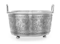 An American Silver Ice Bucket, Tiffany & Co., New York, NY, the handled body having a floral and foliate decorated band and a glass lin