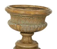 A Pair of Continental Ceramic Urns on Pedestals — EARLY 20TH CENTURY