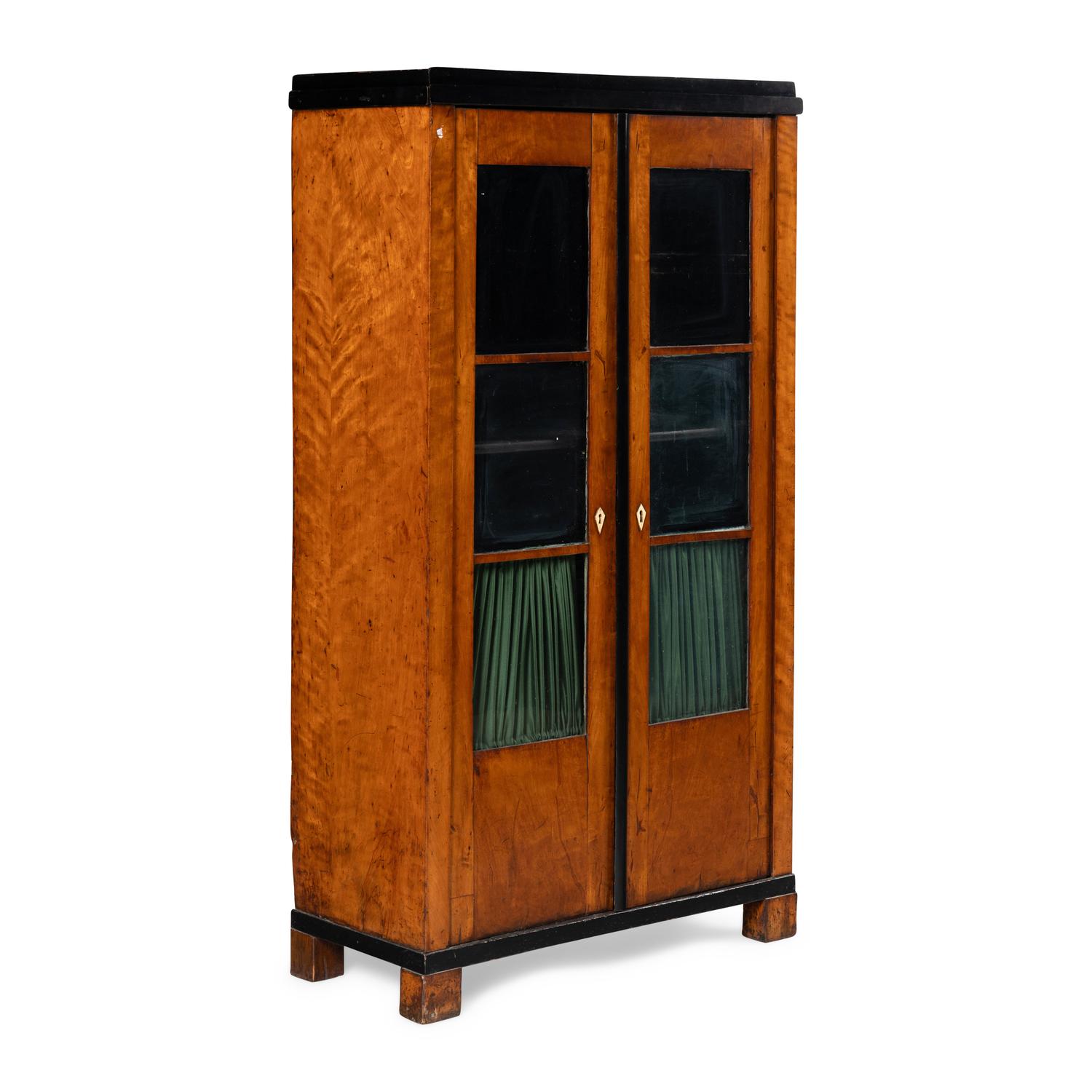 A Biedermeier Figured Maple and Part-Ebonized Bookcase