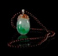 A Jadeite Pendant Length of pendant 1 3/4 inches.