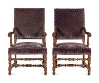 A Pair of Louis XIV Style Carved Fruitwood Fauteuils