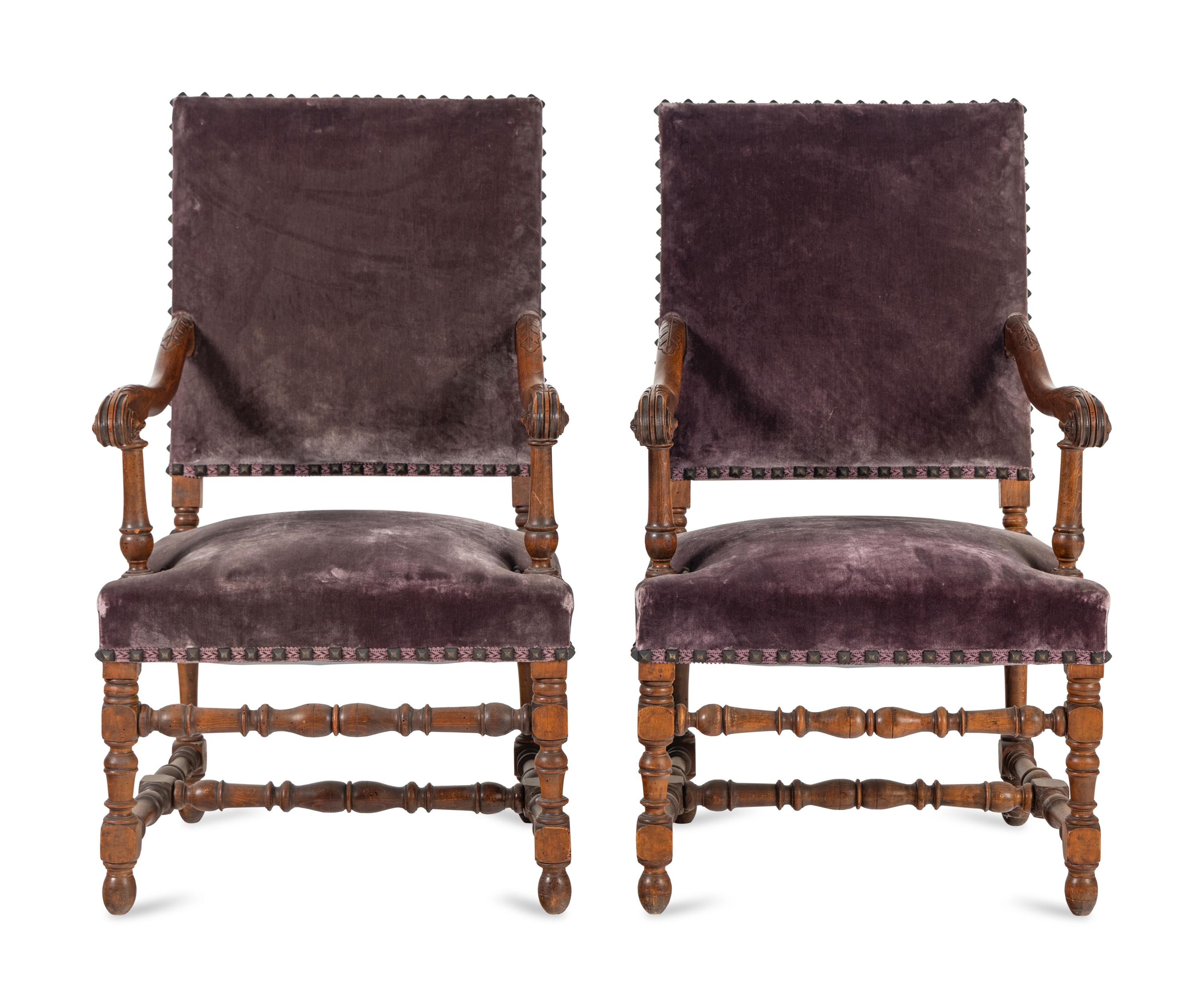 A Pair of Louis XIV Style Carved Fruitwood Fauteuils