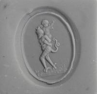 A Neoclassical Gold and Carnelian Finger Ring with the God Eros Riding a Satyr