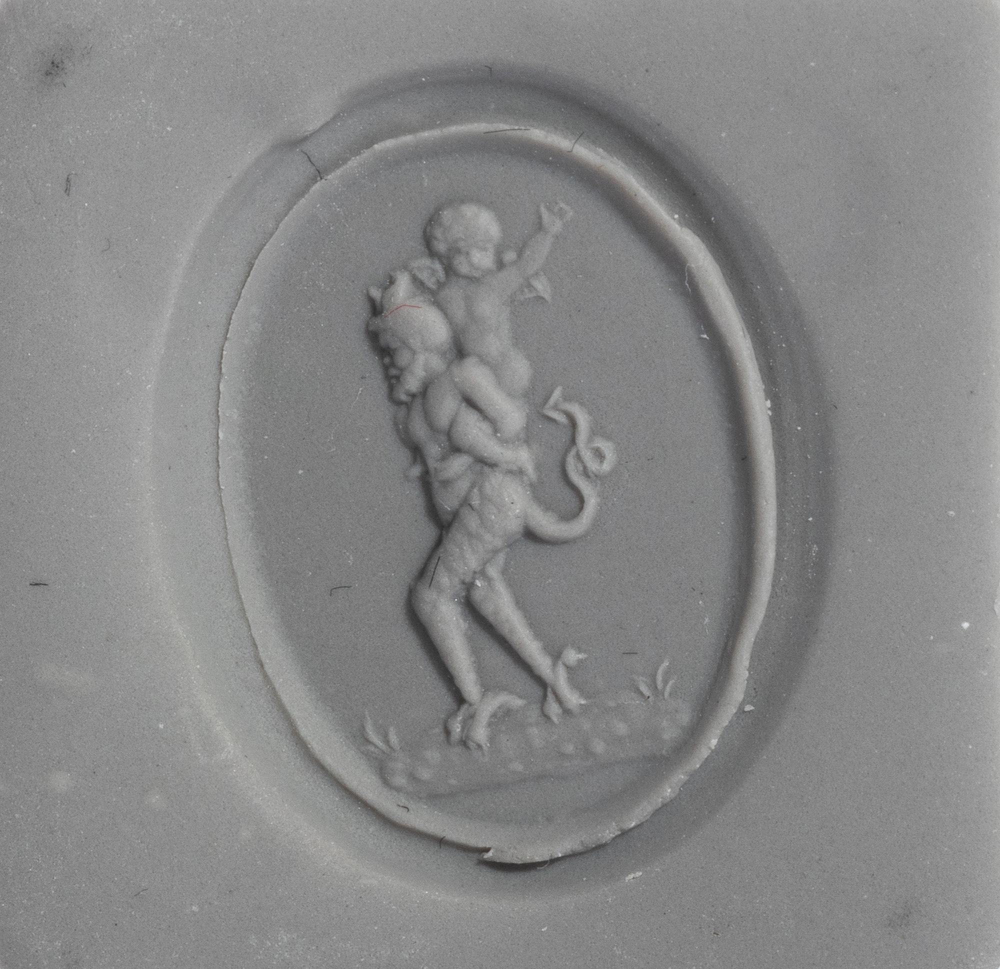 A Neoclassical Gold and Carnelian Finger Ring with the God Eros Riding a Satyr
