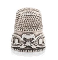 An American Silver Lily of the Valley Thimble, Stern Bros., Philadelphia, PA, the knurled top and body above a band worked to show ribb