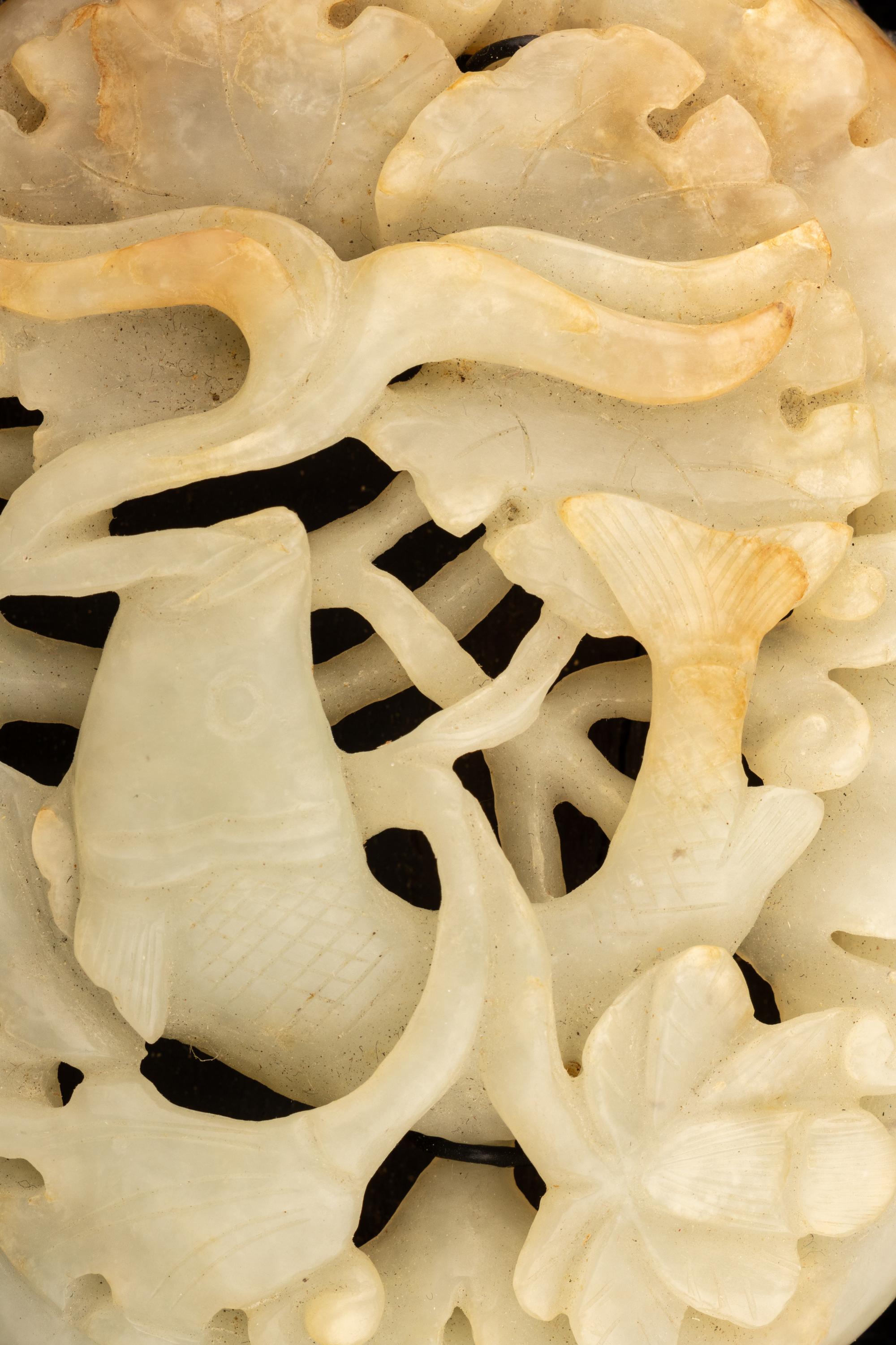A Carved Celadon Jade 'Carp and Lotus' Plaque