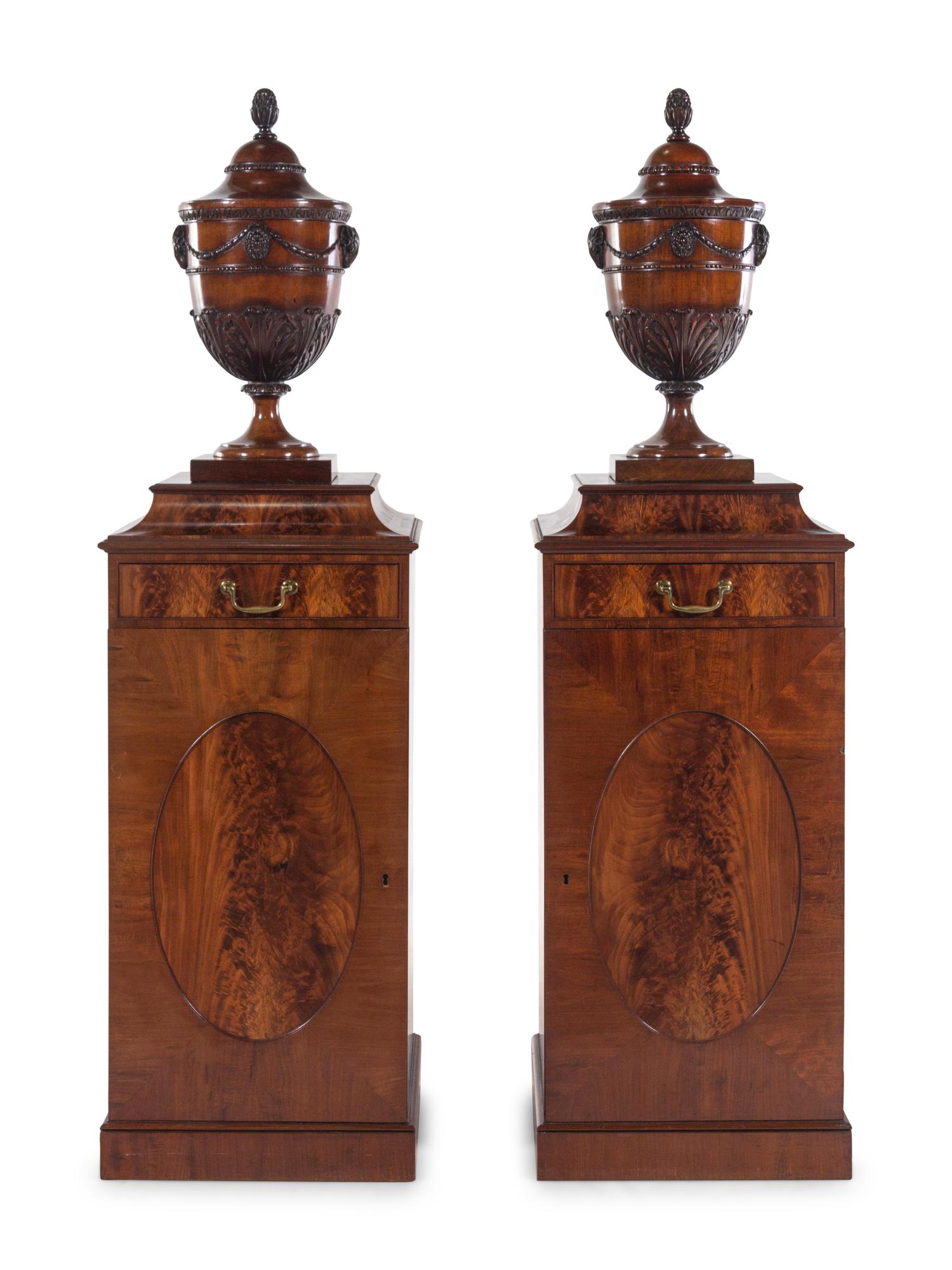 A Pair of Edwardian Style Mahogany Cutlery Urns on Pedestals