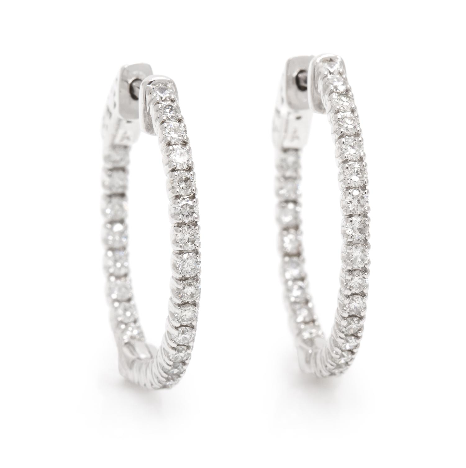 A Pair of 14 Karat White Gold and Diamond Hoop Earrings, 3.50 dwts.