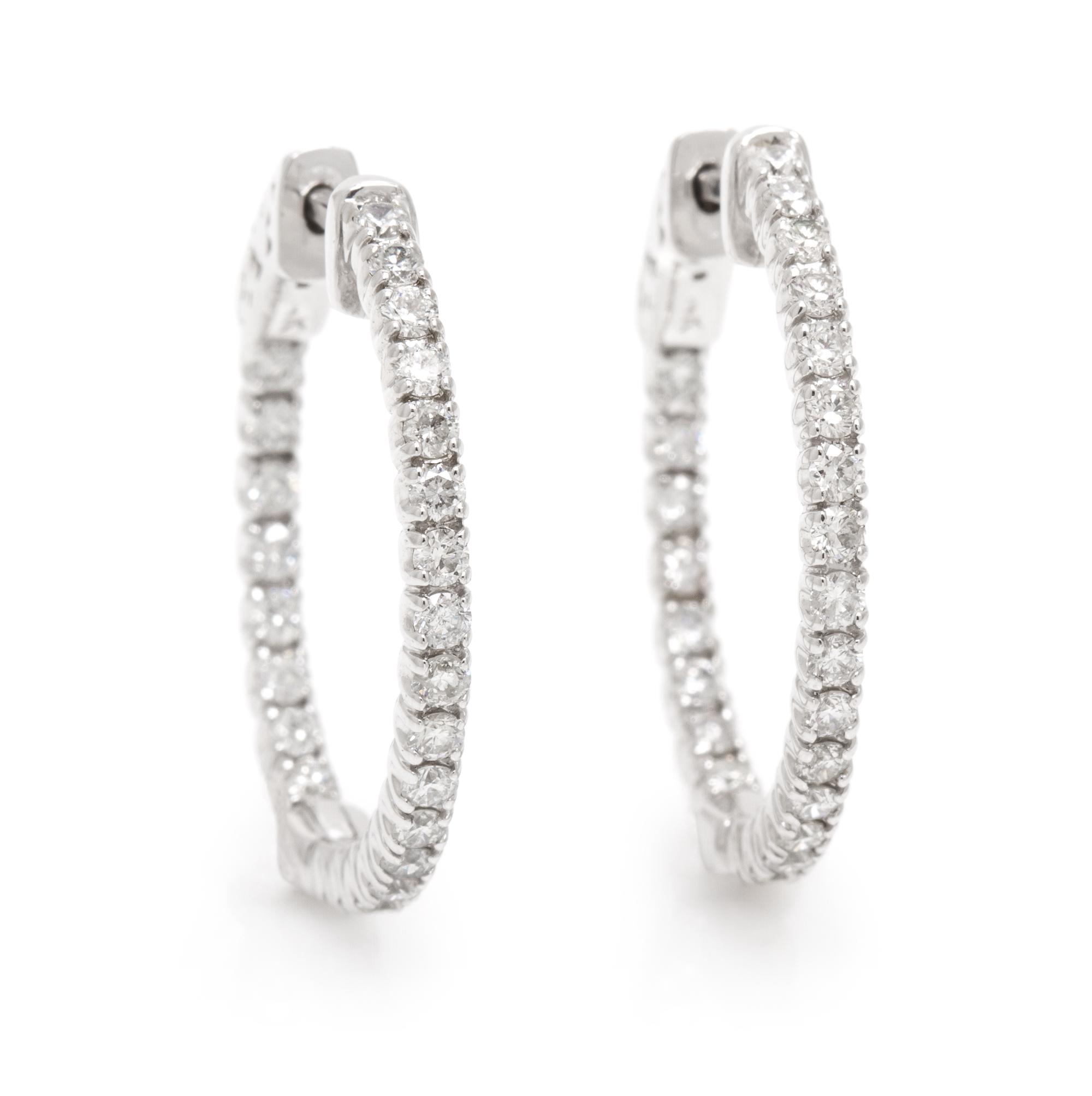 A Pair of 14 Karat White Gold and Diamond Hoop Earrings, 3.50 dwts.