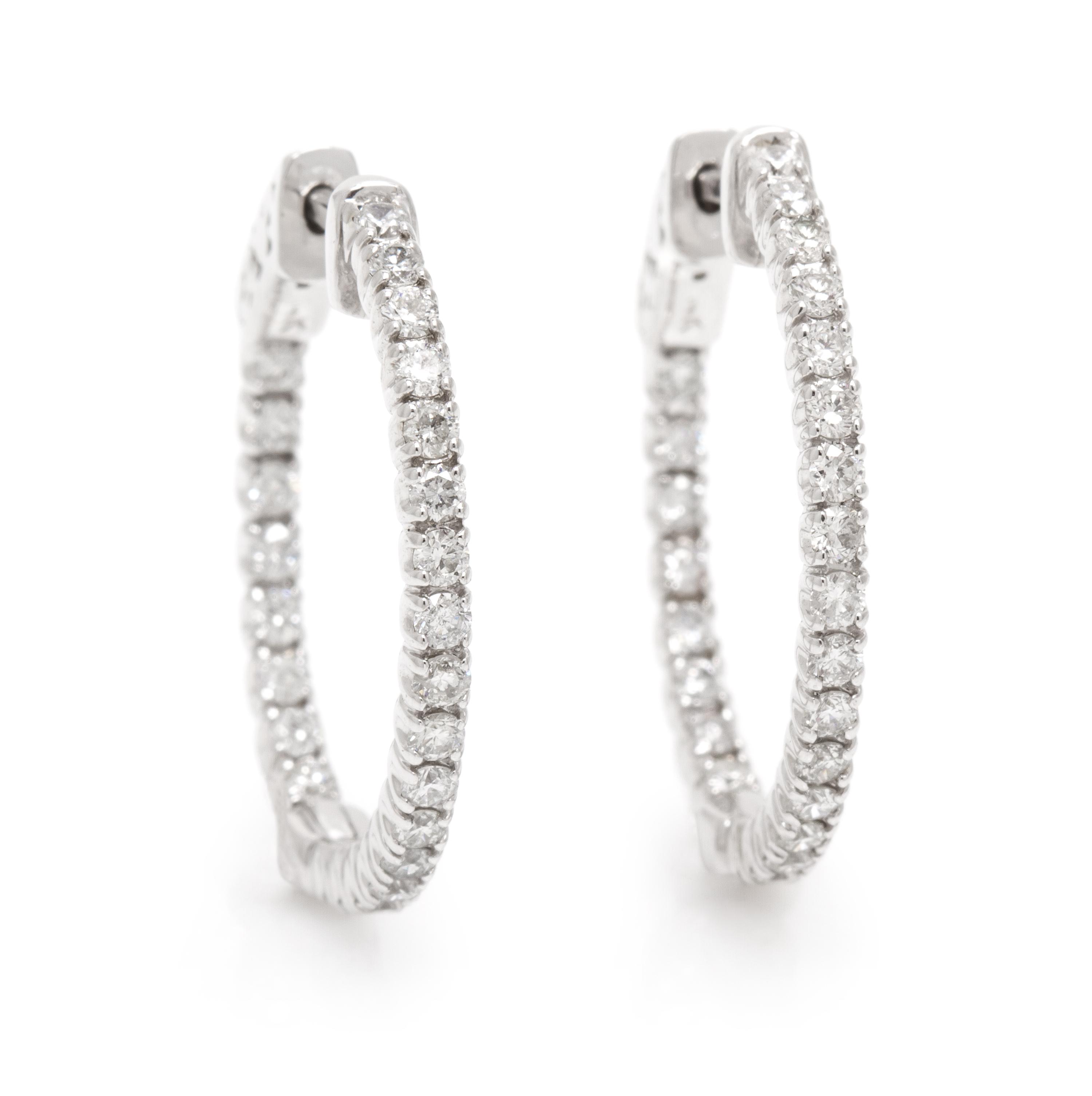 A Pair of 14 Karat White Gold and Diamond Hoop Earrings, 3.50 dwts.