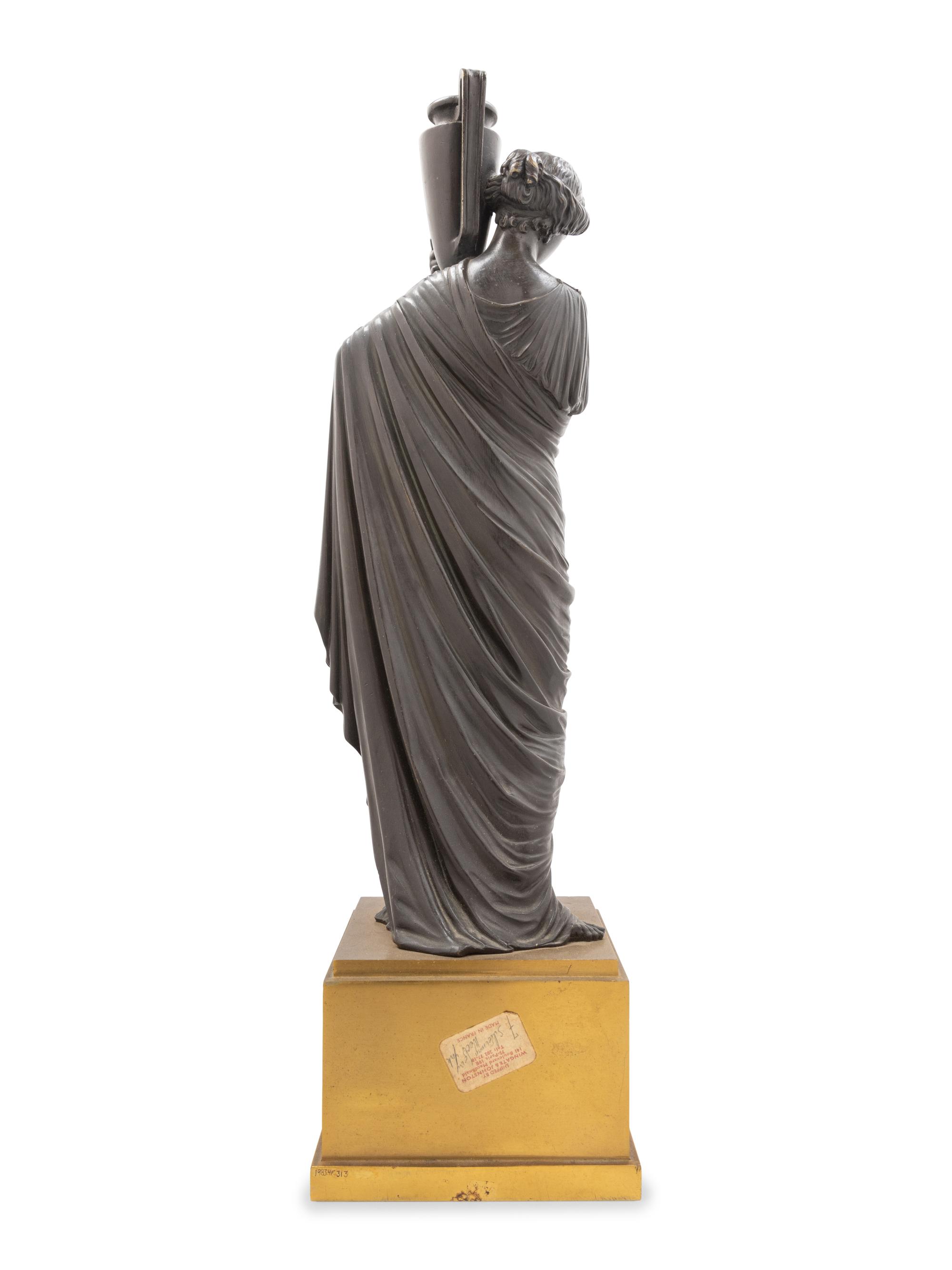 A Continental Bronze Figure of a Classical Maiden with an Ewer
