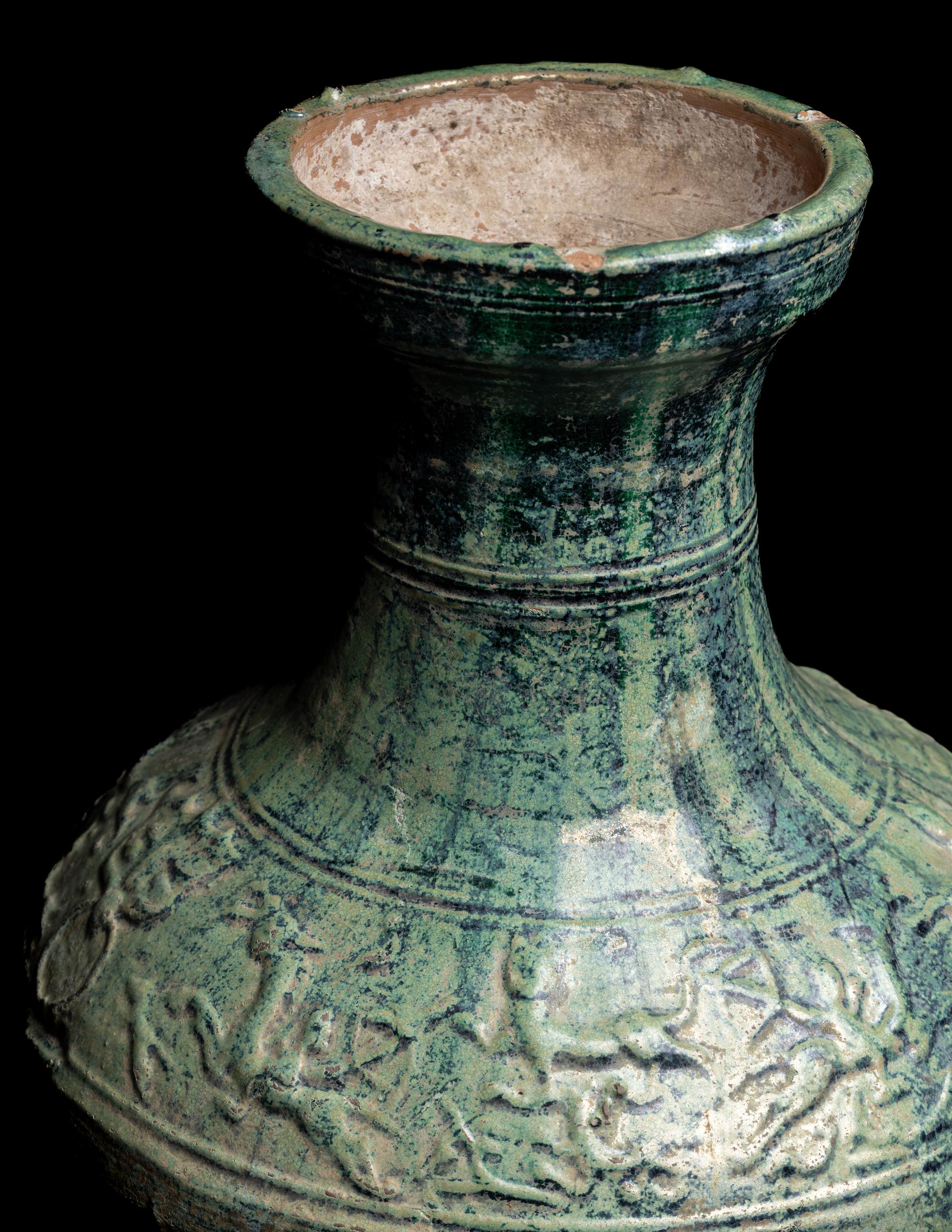 A Chinese Molded Green Glazed Pottery Hu Vase