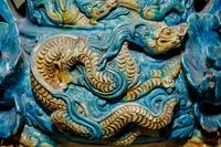 A Turquoise and Ochre Glazed Tileworks Tripod Incense Burner