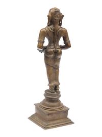 An Indian Patinated Metal Figure of a Standing Deity
