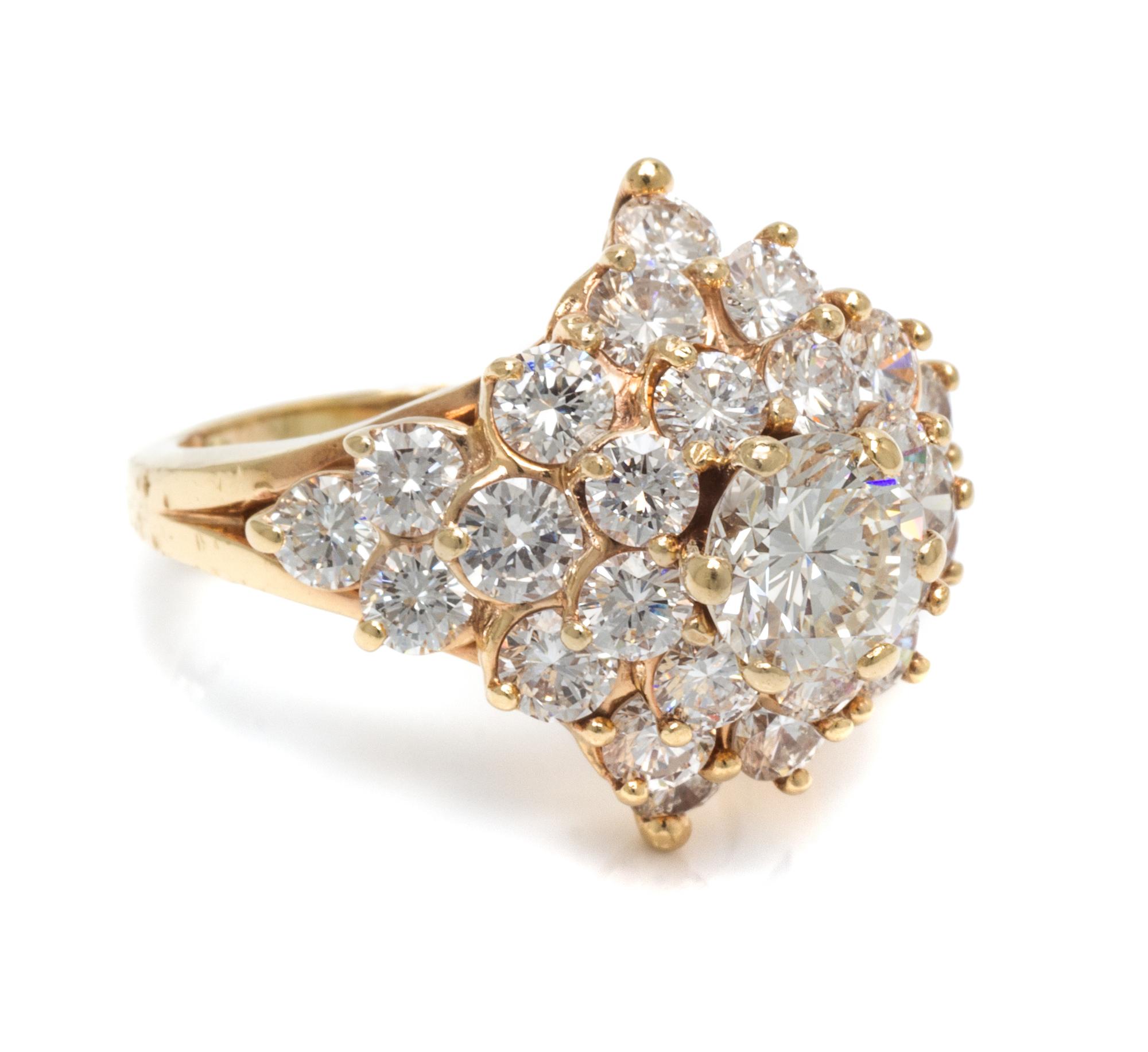 A 14 Karat Yellow Gold and Diamond Cluster Ring,