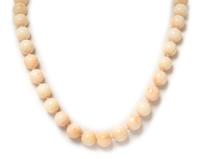 A 14 Karat Yellow Gold and Pink Coral Bead Necklace, 100.80 dwts.