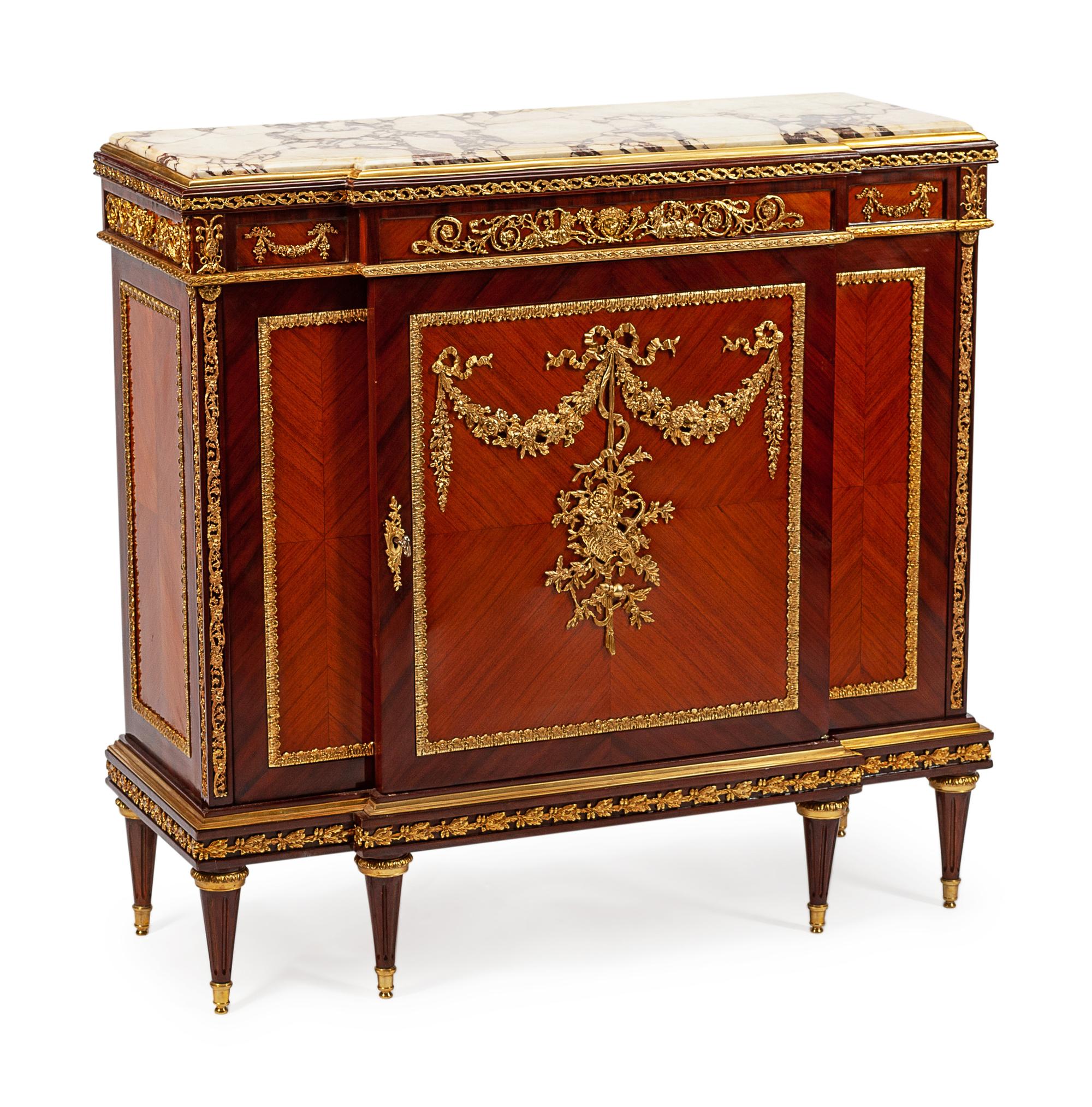 A Louis XVI Style Gilt Bronze Mounted Kingwood and Tulipwood Cabinet