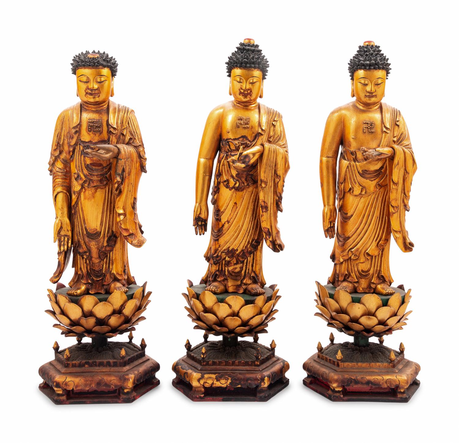 Three Gilt Lacquered Wood Figures of Buddha
