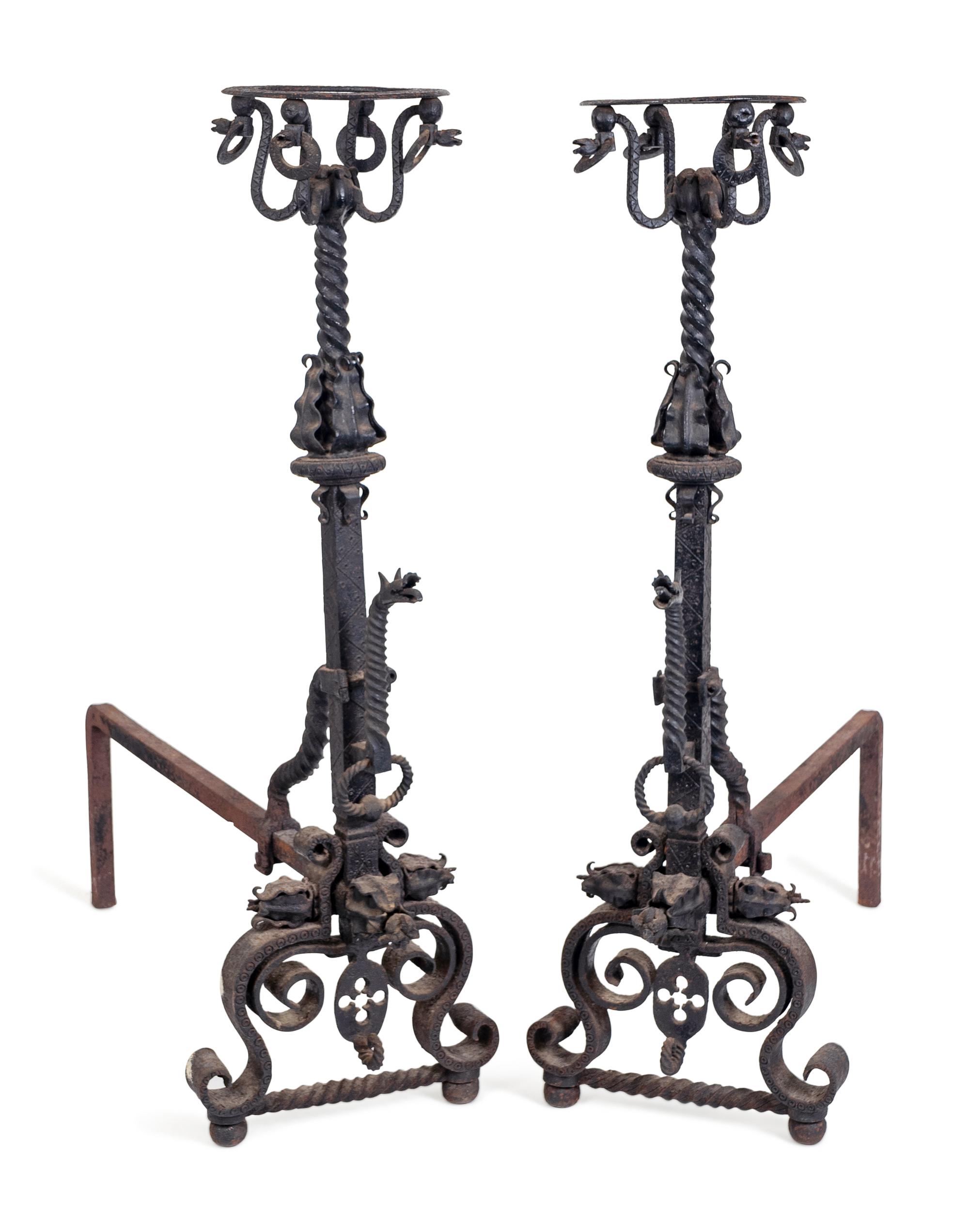 A Pair of Renaissance Style Wrought-Iron Andirons — IN THE MANNER OF SAMUEL YELLIN, EARLY 20TH CENTURY