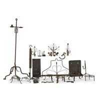 Large collection of twenty-seven wrought iron and metal fireplace and lighting implements 18th/19th century