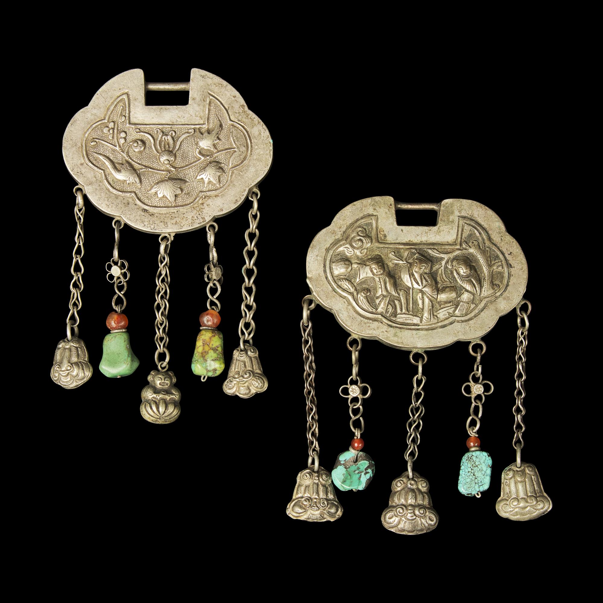A Chinese Silver Necklace and Eight Chinese Silver Ruyi Lock-Form Pendants, Qing Dynasty 清 銀項圈一及銀如意頭形長命鎖一組八件