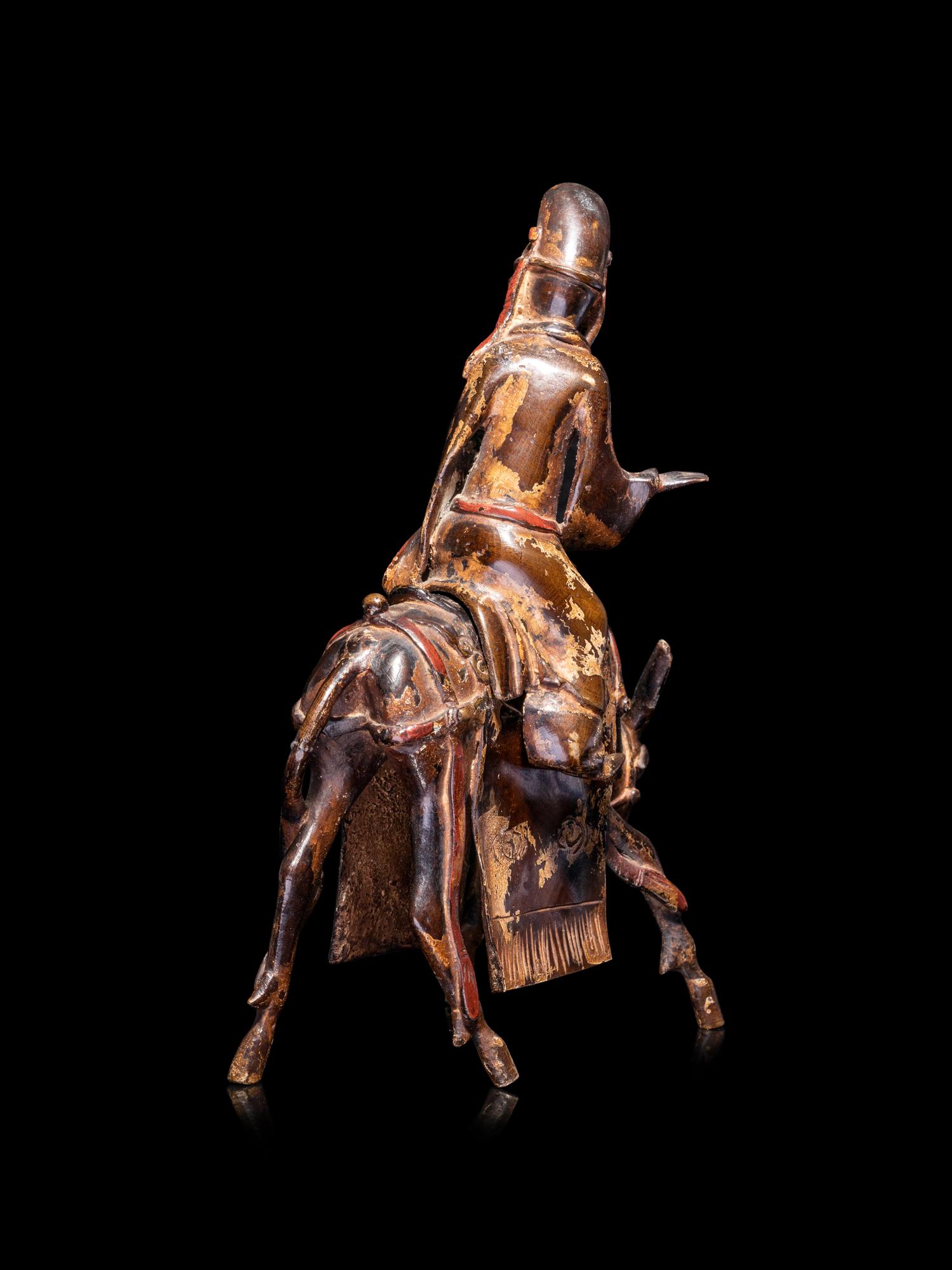 A Chinese Parcel-Gilt Bronze Figural-Form Incense Burner