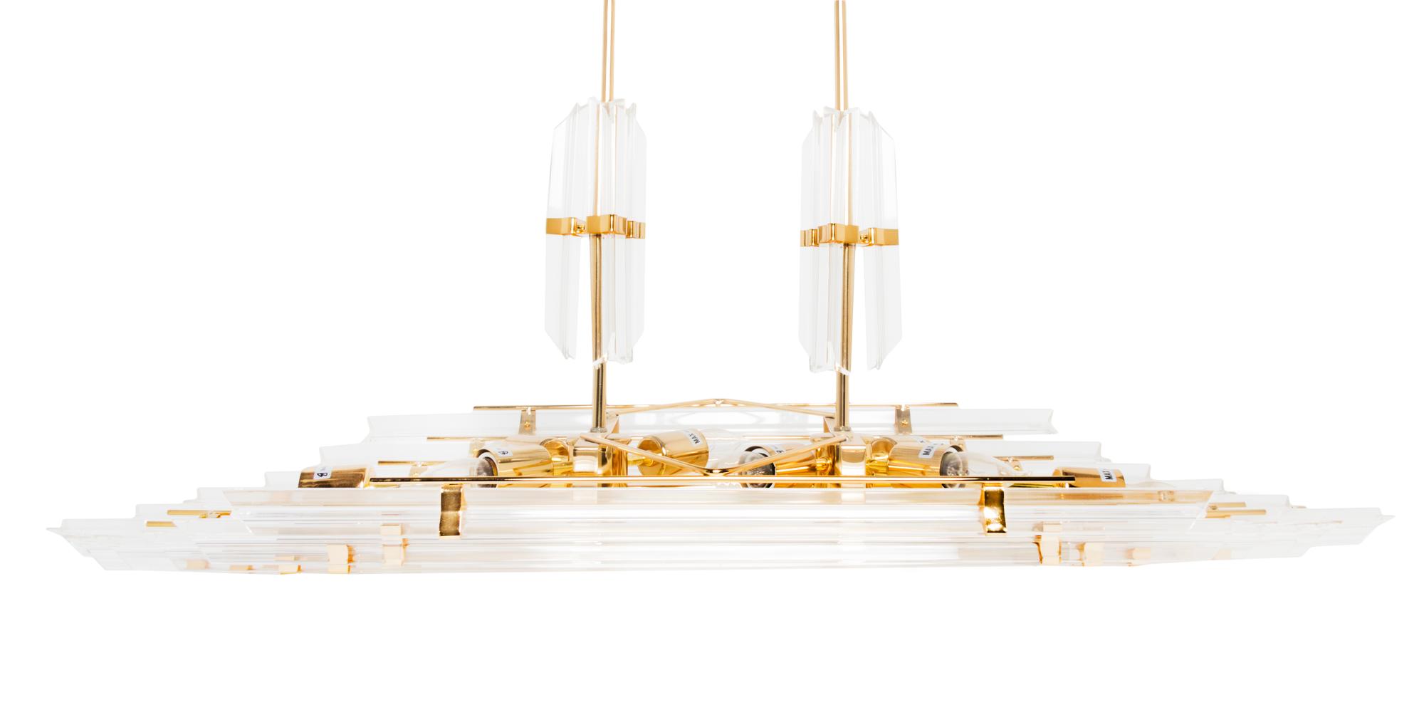 A Lucite and Brass Eight-Light Chandelier Length 44 inches.