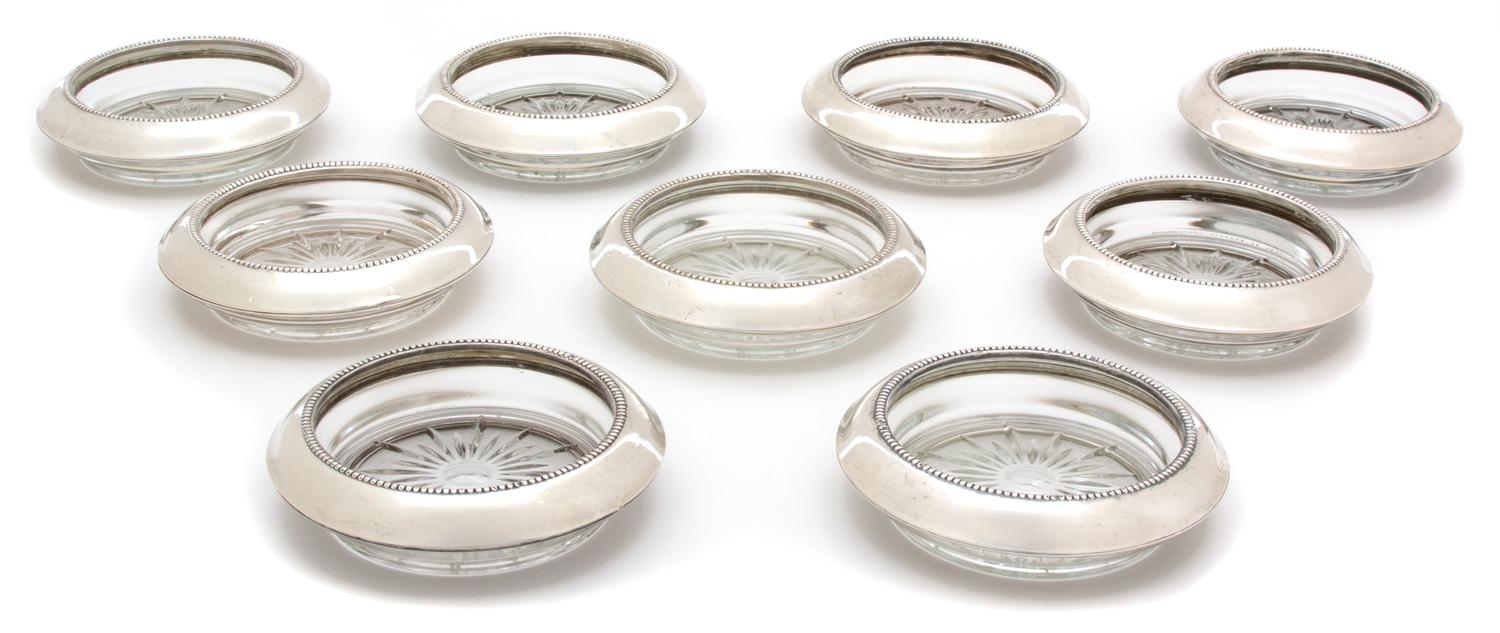 A Set of Nine American Silver Collared Glass Coasters, Frank M. Whiting & Co., North Attleboro, MA, 20th Century, with glass inserts