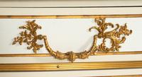 A Pair of Louis XIV Style Cream-Painted and Gilt Bronze Mounted Marble-Top Commodes
