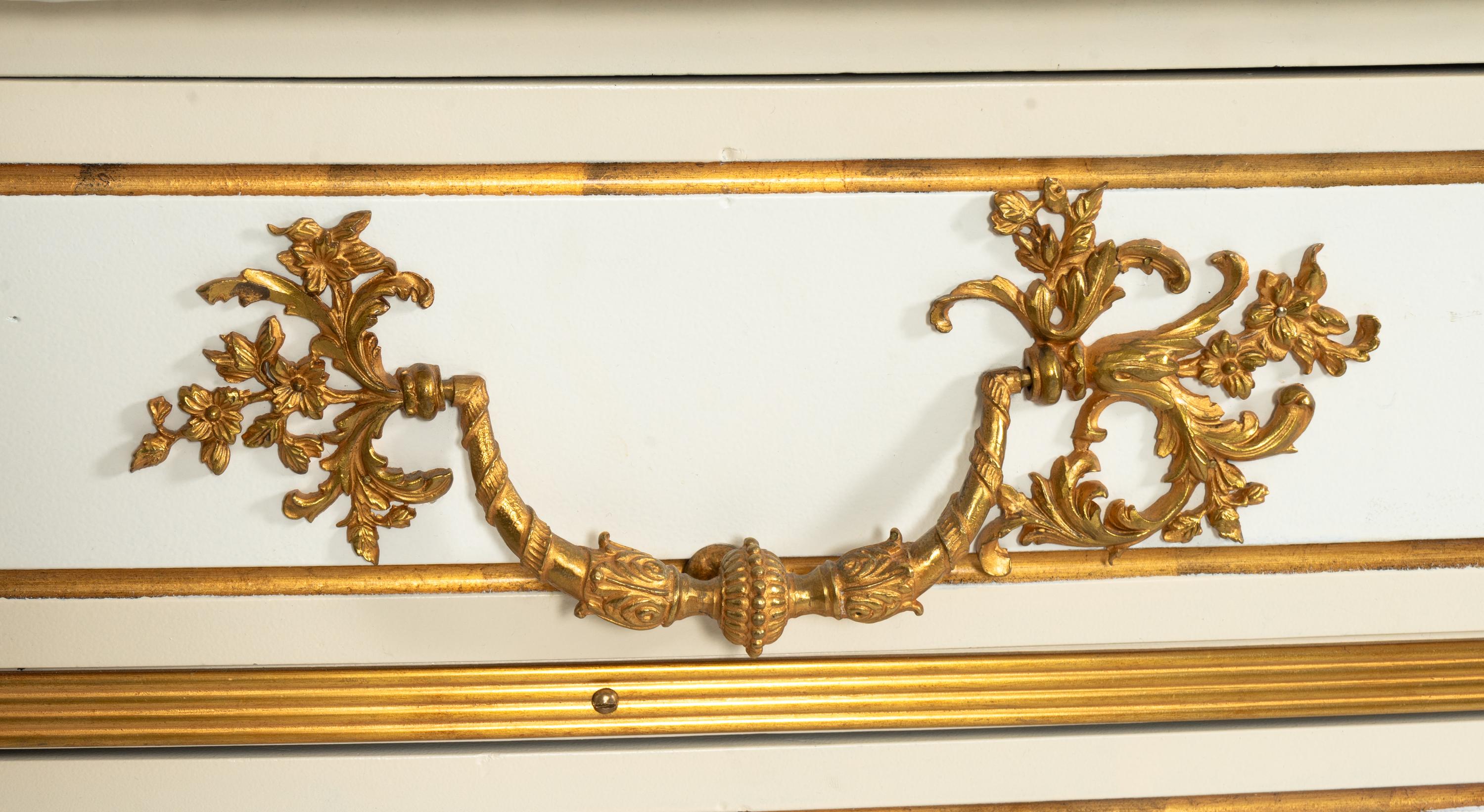 A Pair of Louis XIV Style Cream-Painted and Gilt Bronze Mounted Marble-Top Commodes