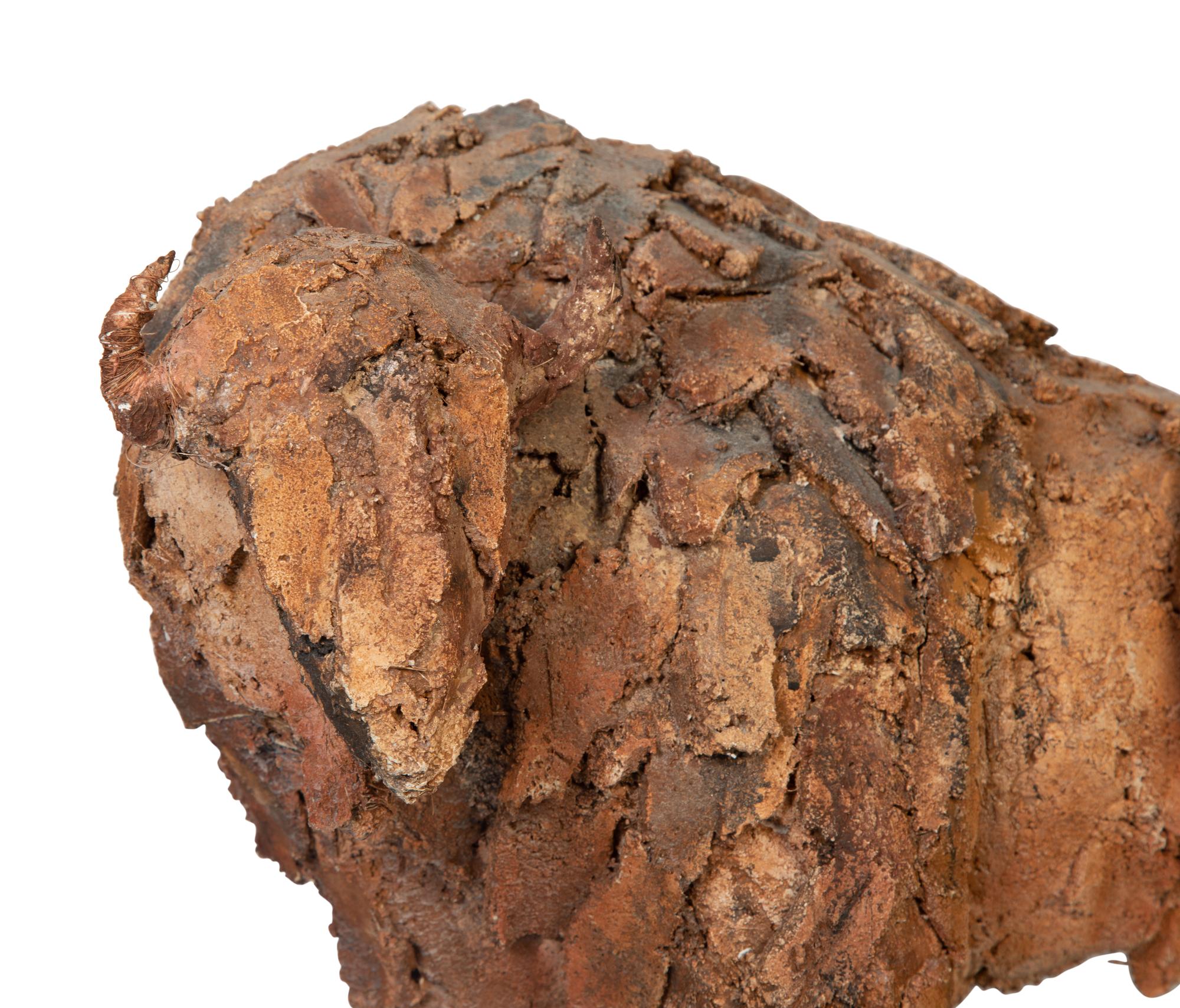 A Clay and Straw Sculpture of a Buffalo