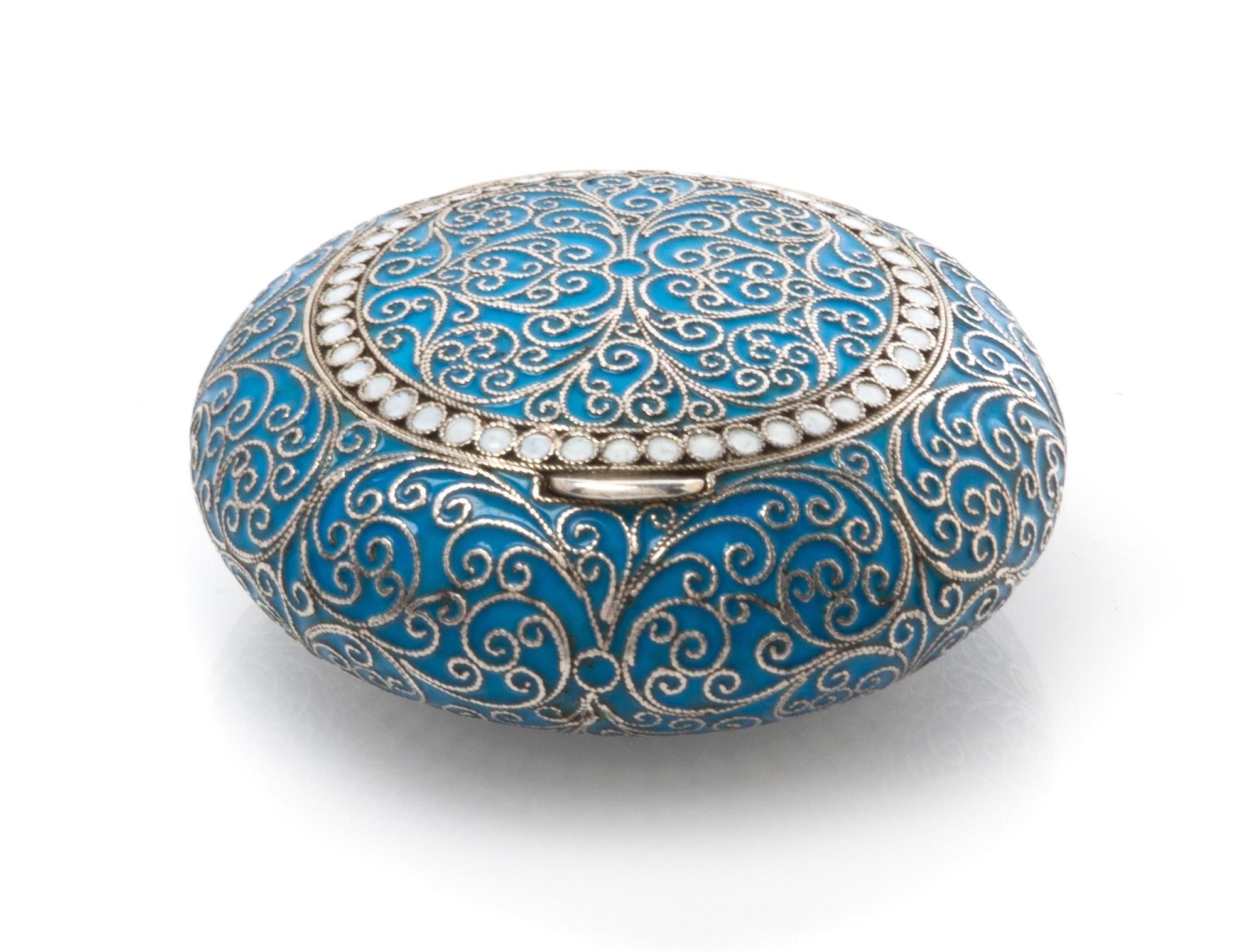 A Russian Enameled Silver Snuff Box, Maker's mark GK, Moscow, late 19th/early 20th century, of circular form, having a light blue ename