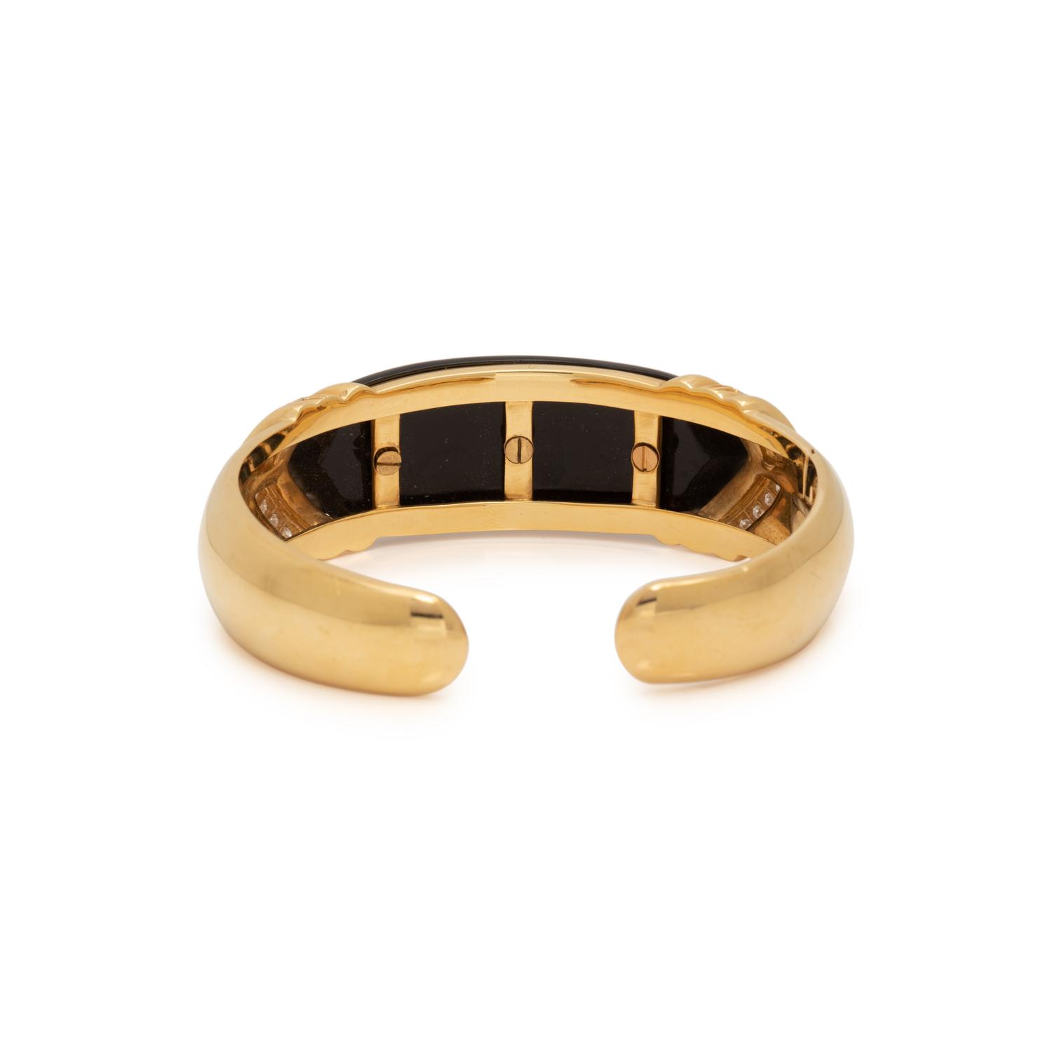 YELLOW GOLD, ONYX AND DIAMOND CUFF BRACELET