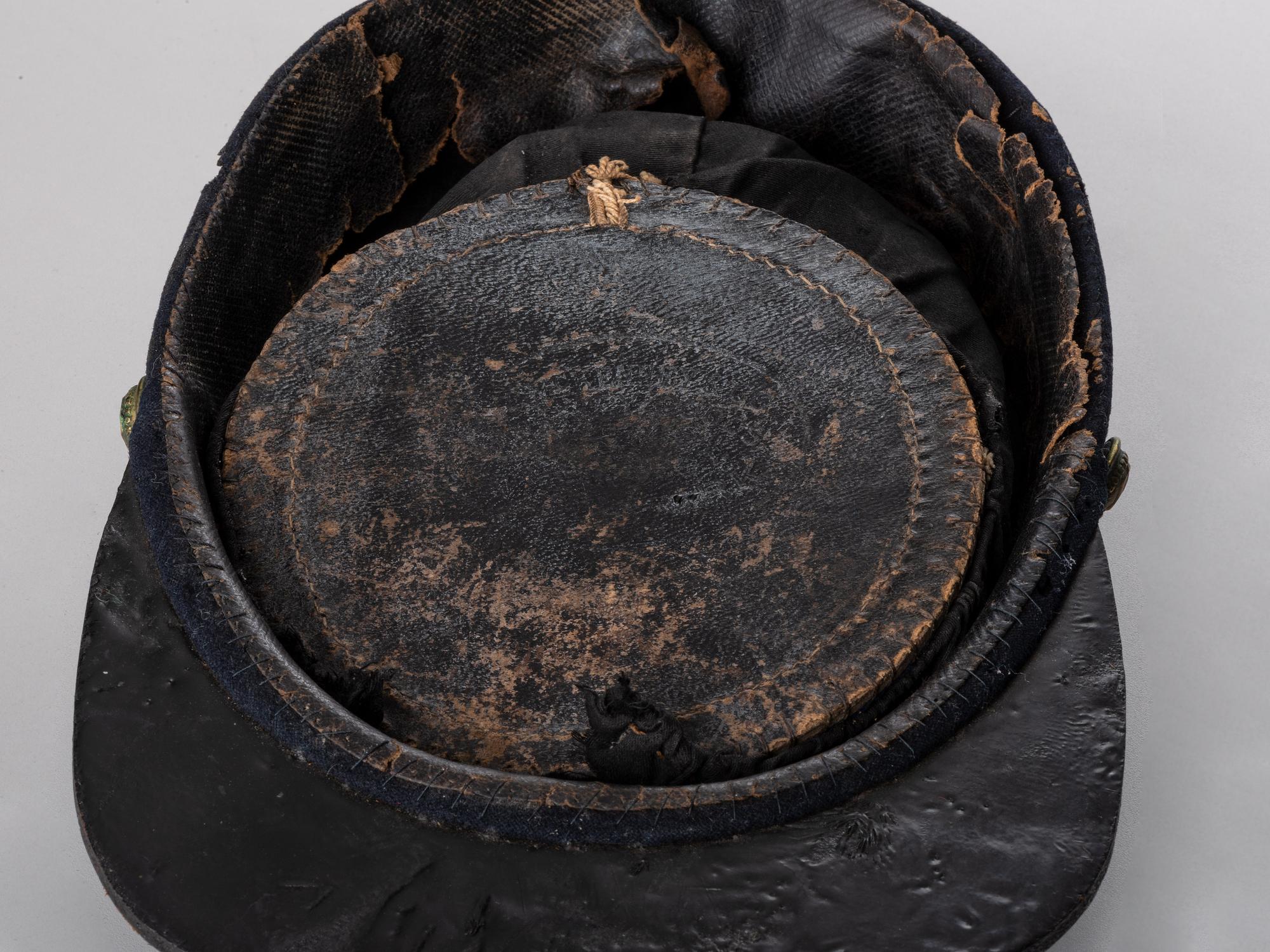 [CIVIL WAR]. Late-war 12th New York Militia kepi, manufactured by J.H. McKenney & Co., New York.