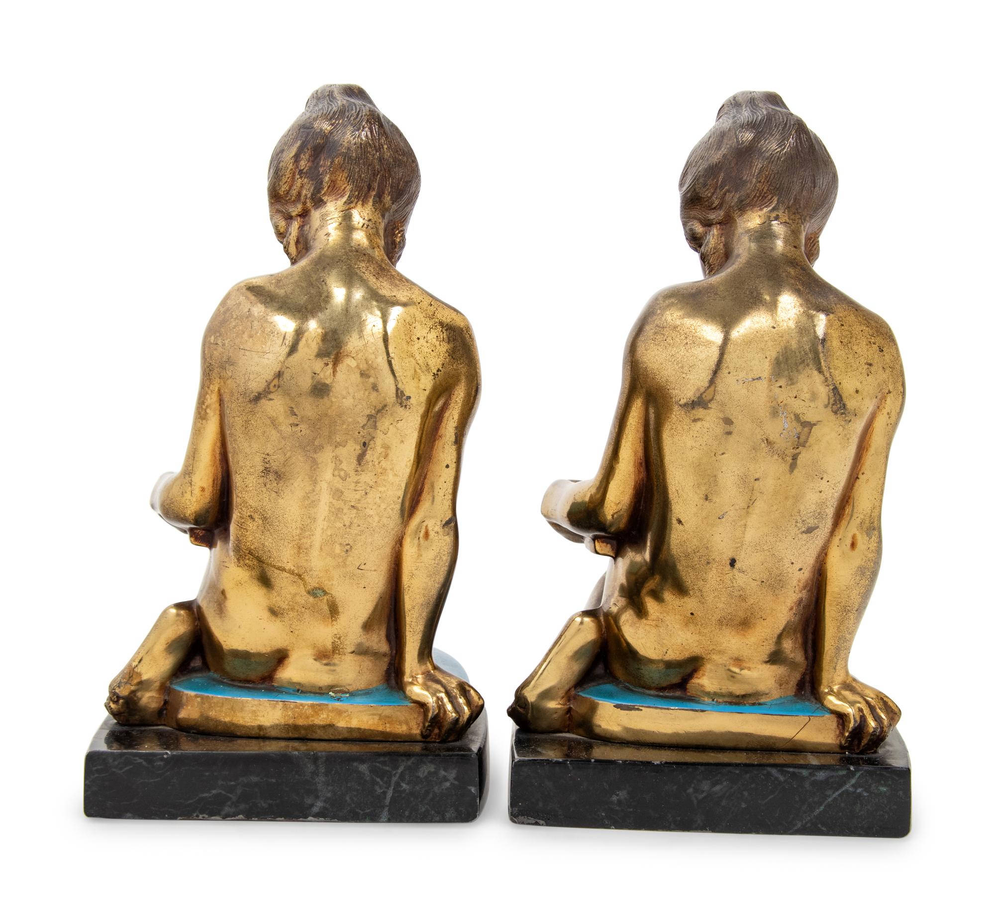 A Pair of Gilt Metal Figures of Seated Maidens