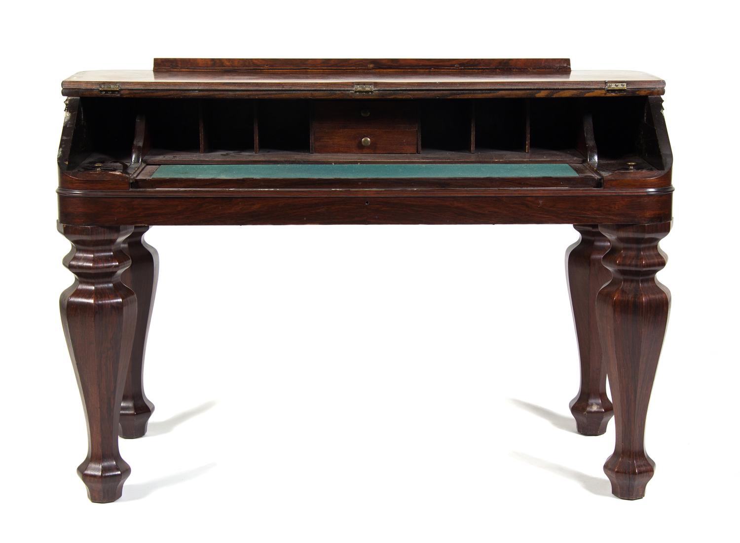 An American Rosewood Desk Height 32 3/4 x width 48 3/4 x depth 23 inches.