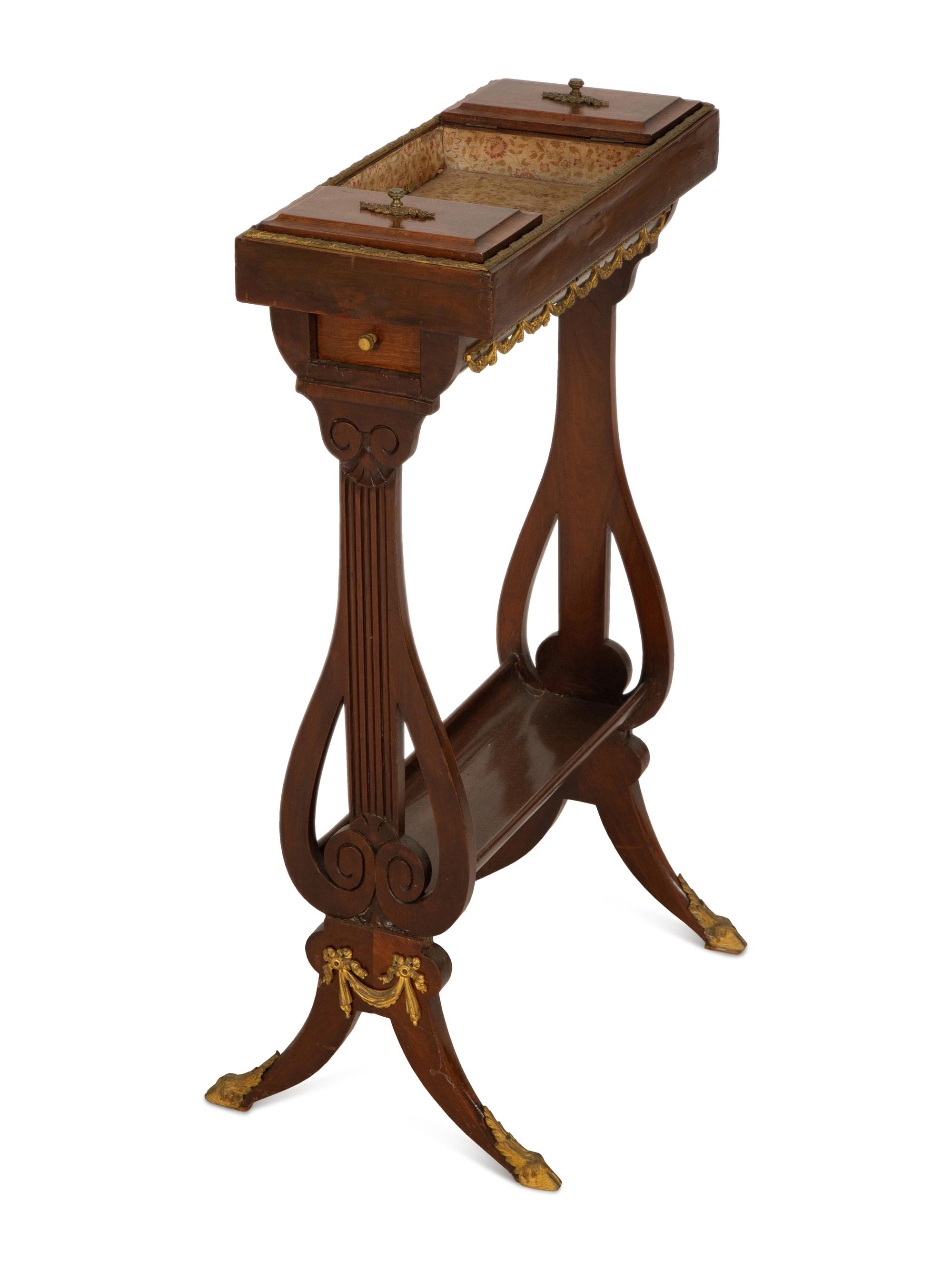A French Empire Gilt Metal Mounted Mahogany Work Table