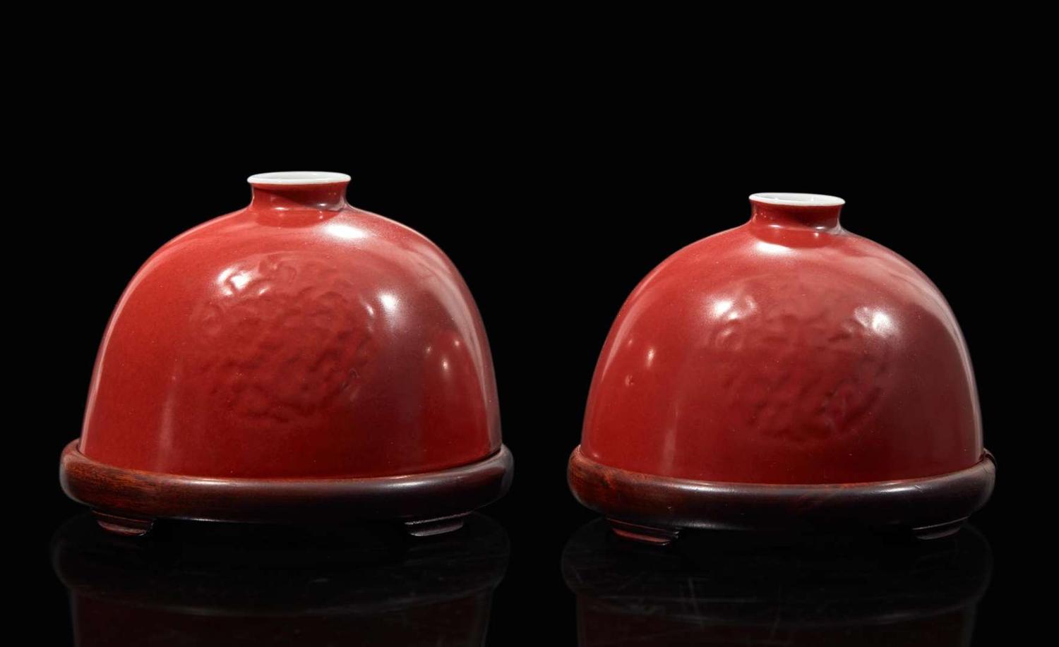 A pair of Chinese iron-red enameled water coupes with hardwood bases 礬紅太白尊一對及木座