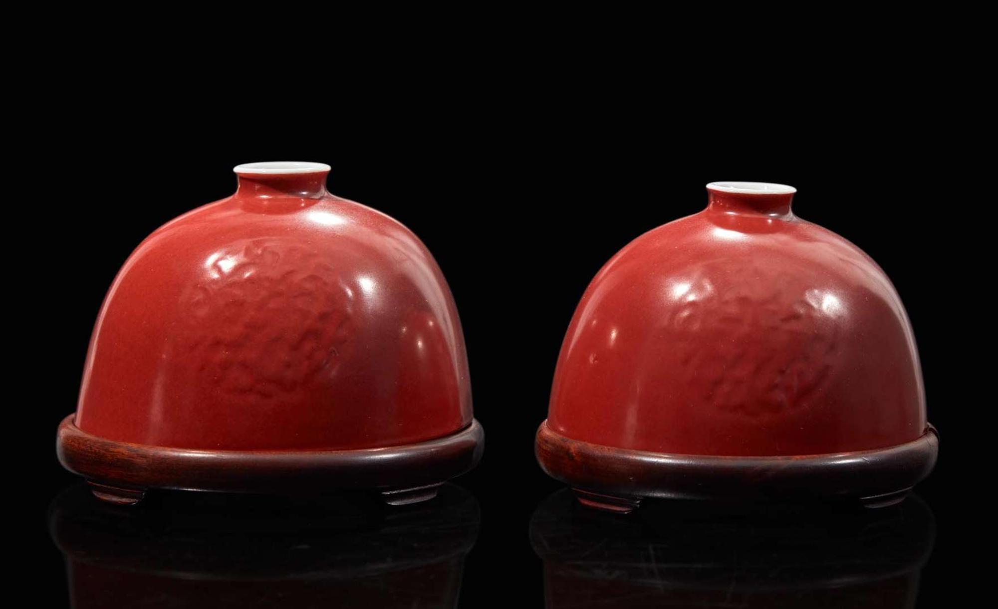 A pair of Chinese iron-red enameled water coupes with hardwood bases 礬紅太白尊一對及木座