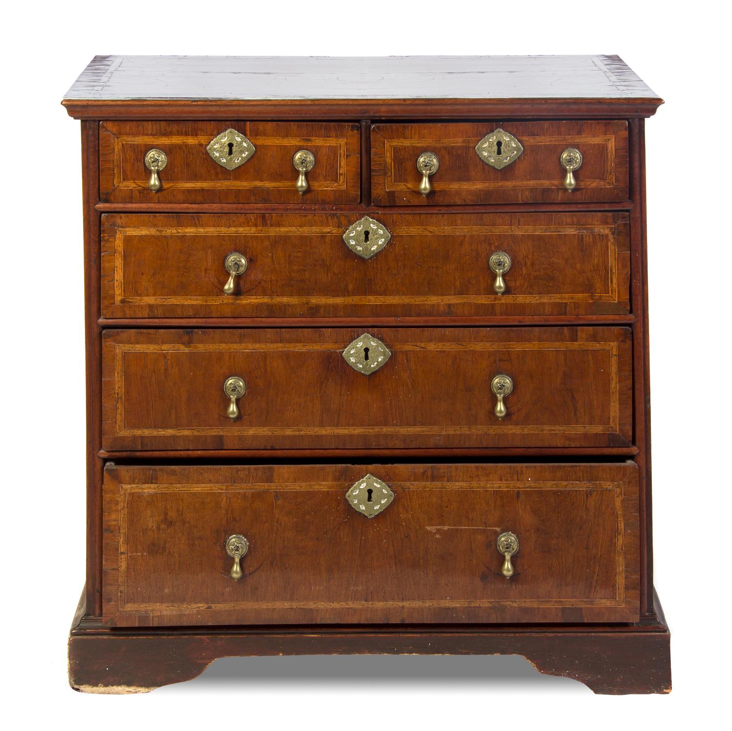 A Charles II Walnut Chest of Drawers, Height 34 x width 35 x depth 21 inches.