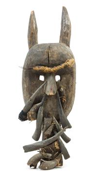 A Toma Wood and Boar's Tusk Mask Height 28 inches. — SIERRA LEONE, 19TH/20TH CENTURY