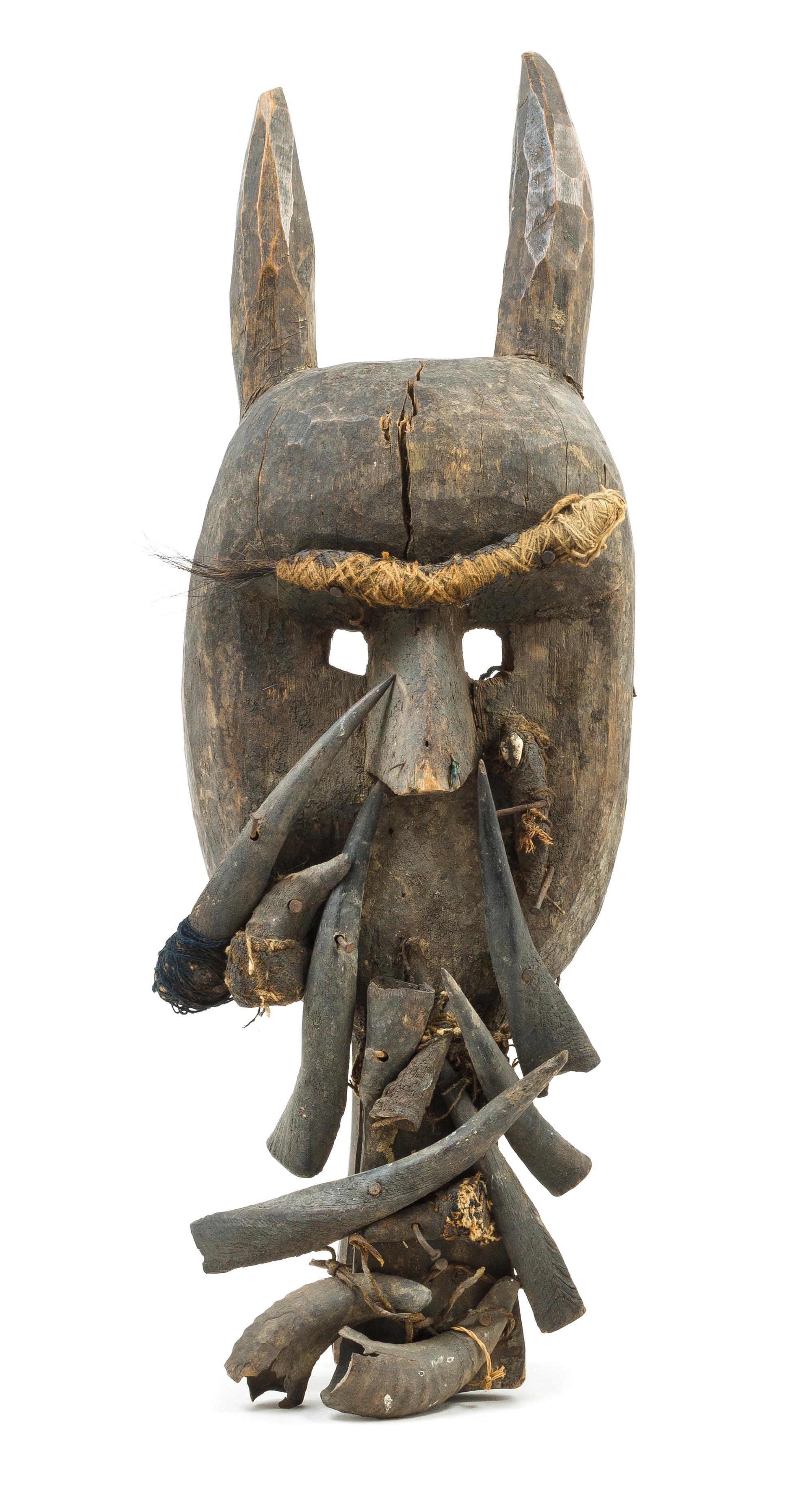 A Toma Wood and Boar's Tusk Mask Height 28 inches. — SIERRA LEONE, 19TH/20TH CENTURY