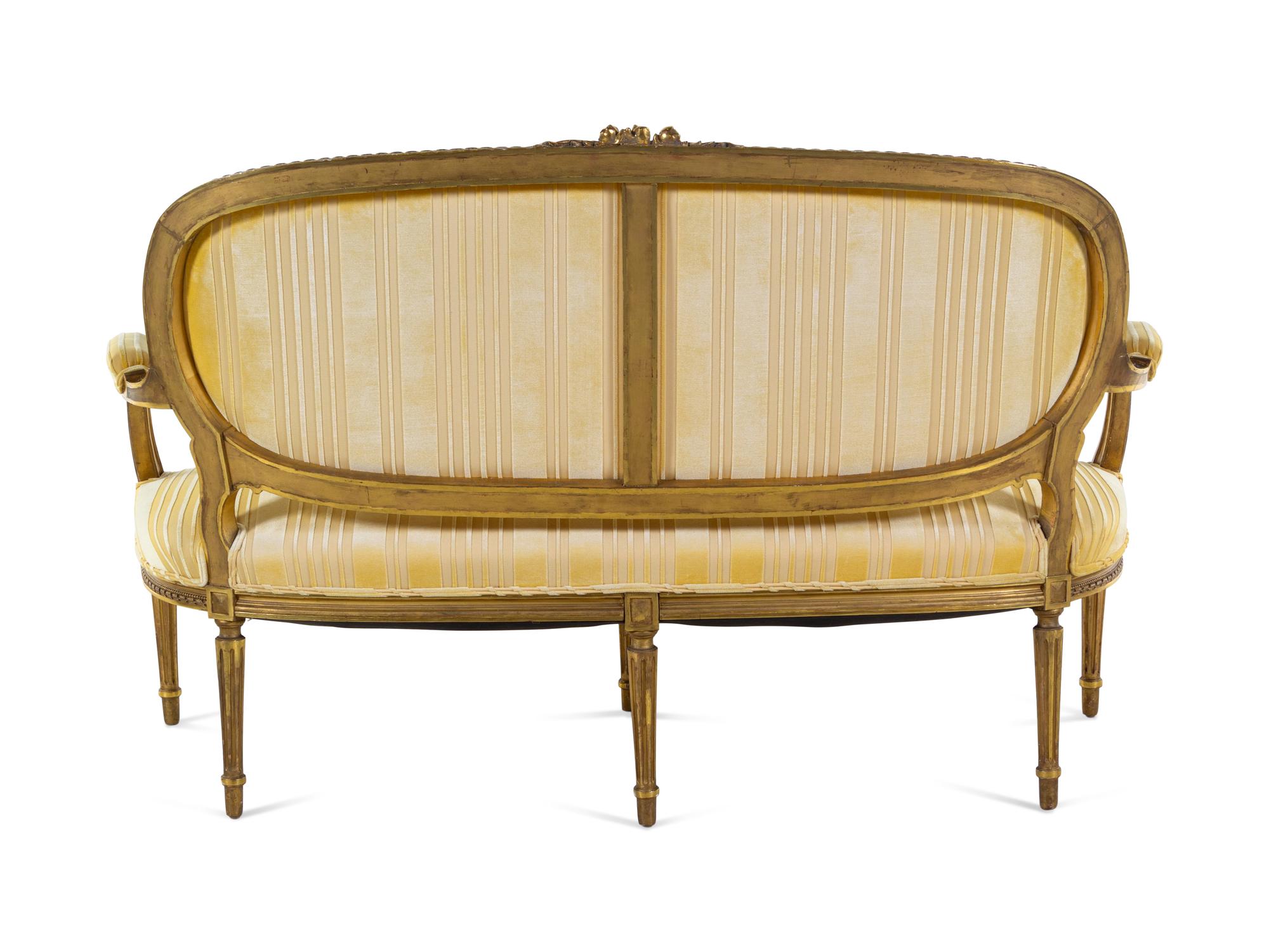 A Louis XVI Style Carved Giltwood Sofa
