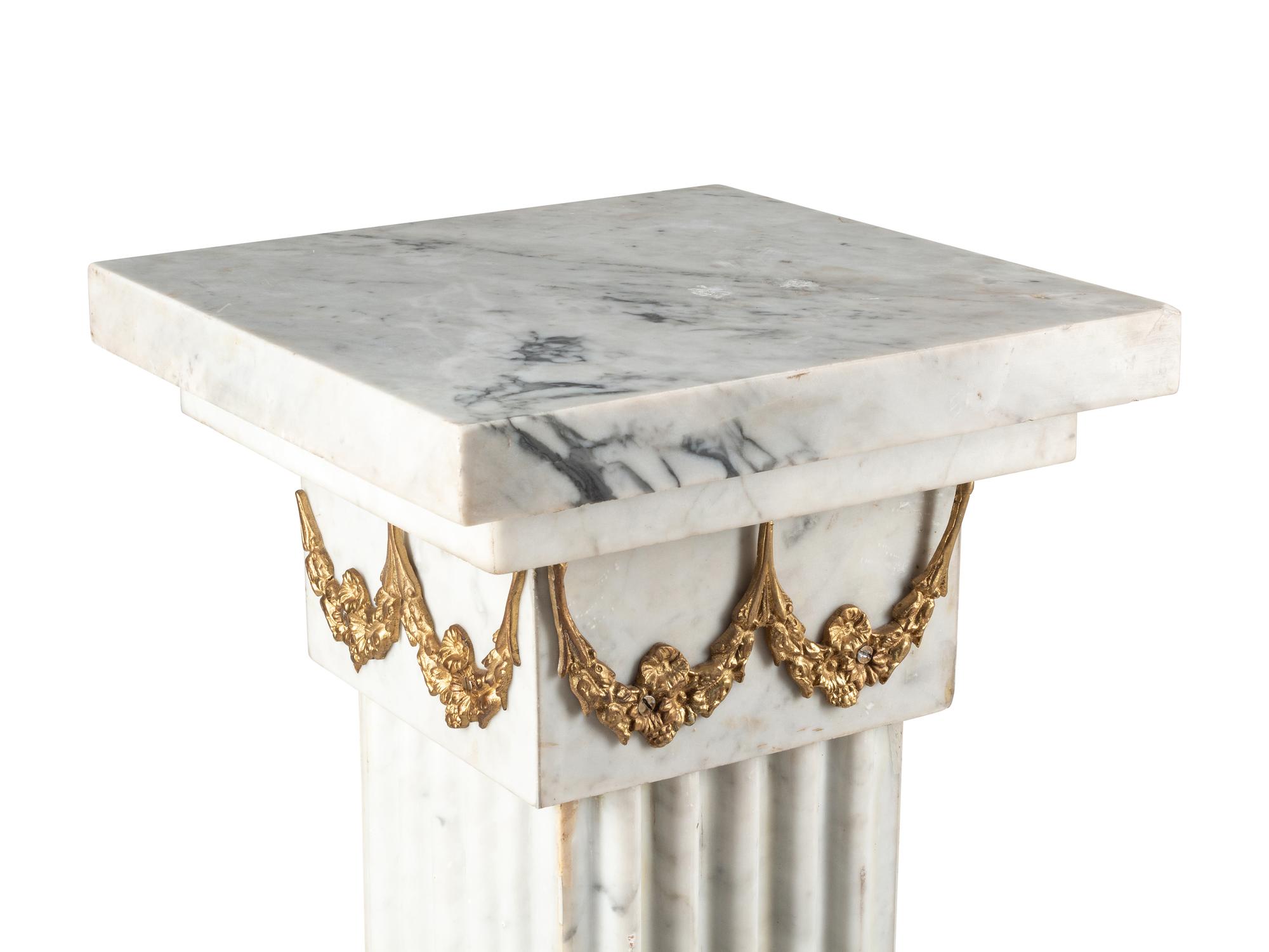 A Pair of Louis XVI Style Gilt Bronze Mounted White Marble Pedestals