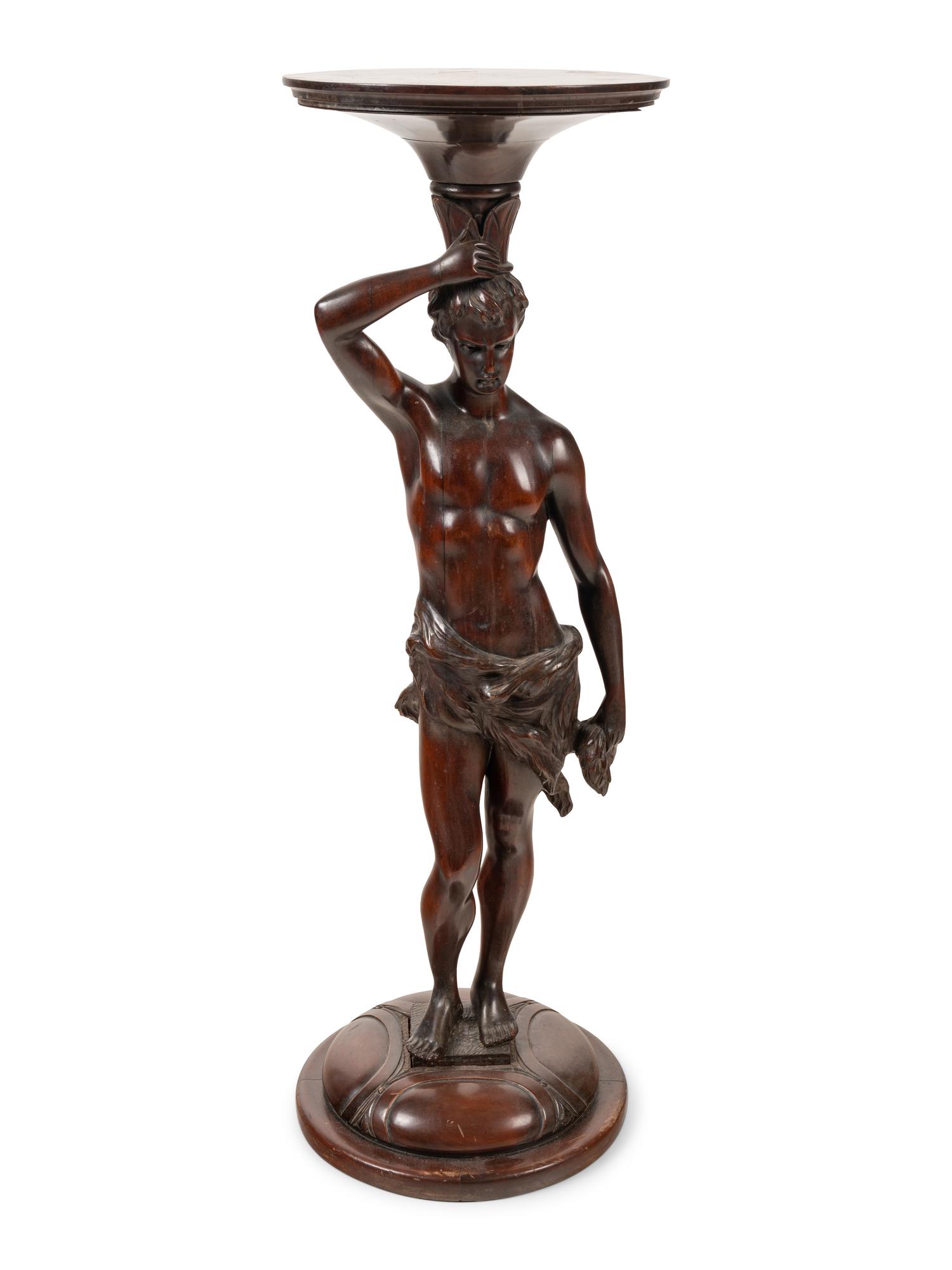 A Continental Carved Mahogany Figural Pedestal