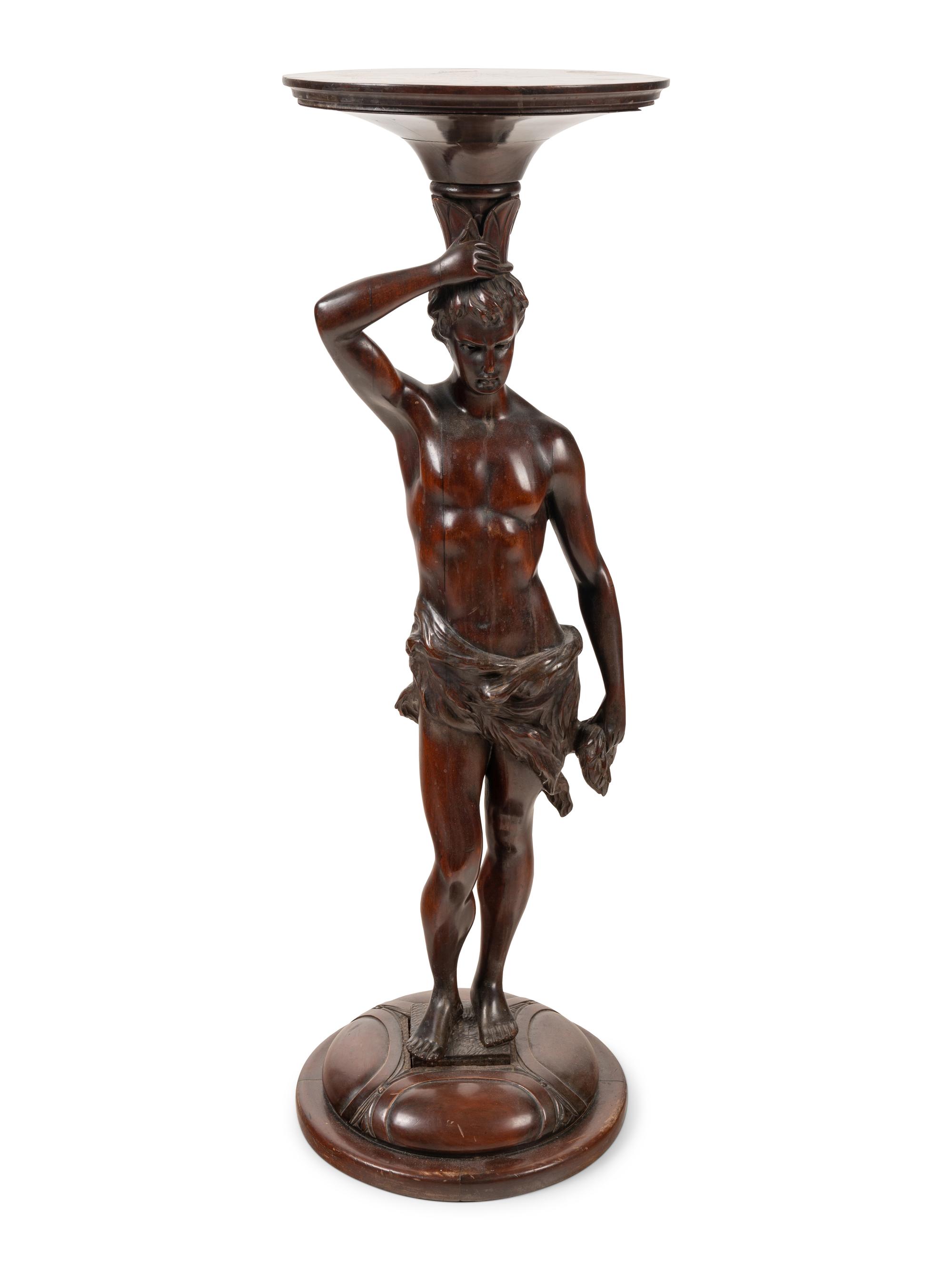 A Continental Carved Mahogany Figural Pedestal
